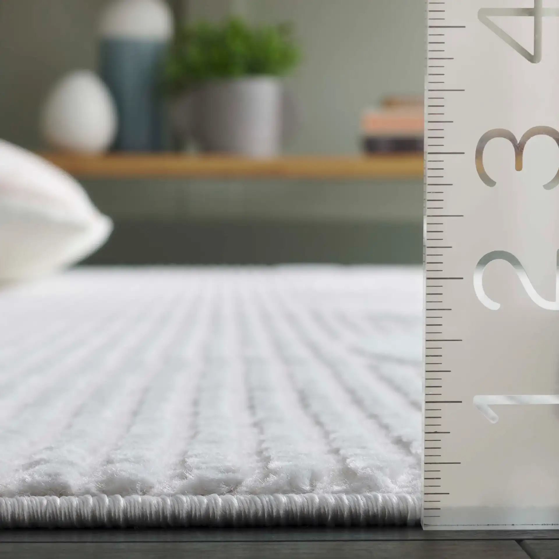 Saylor Arch Rug in Ivory in a styled room