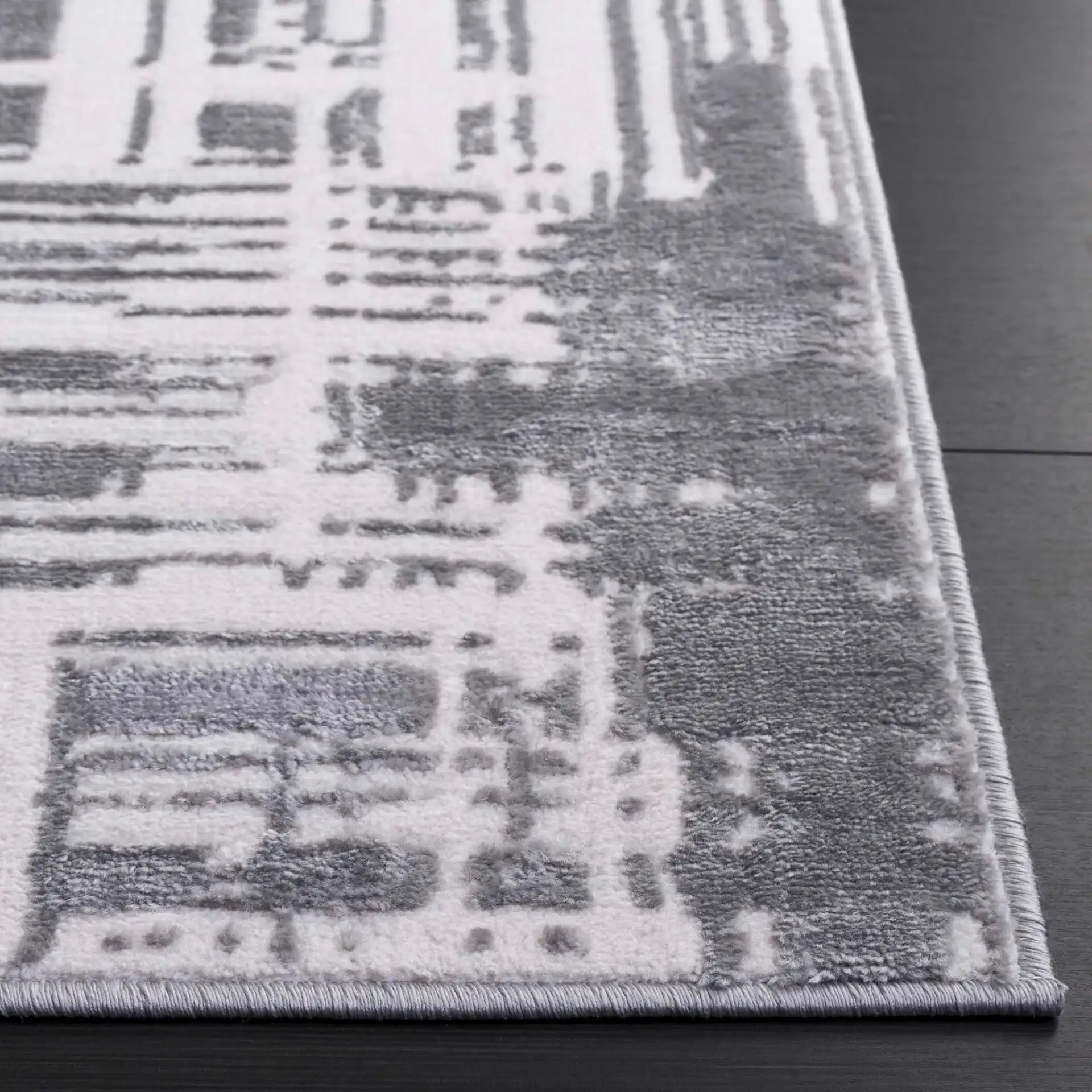 Saylor Abstract Grid Rug in Ivory / Dark Gray in a styled room