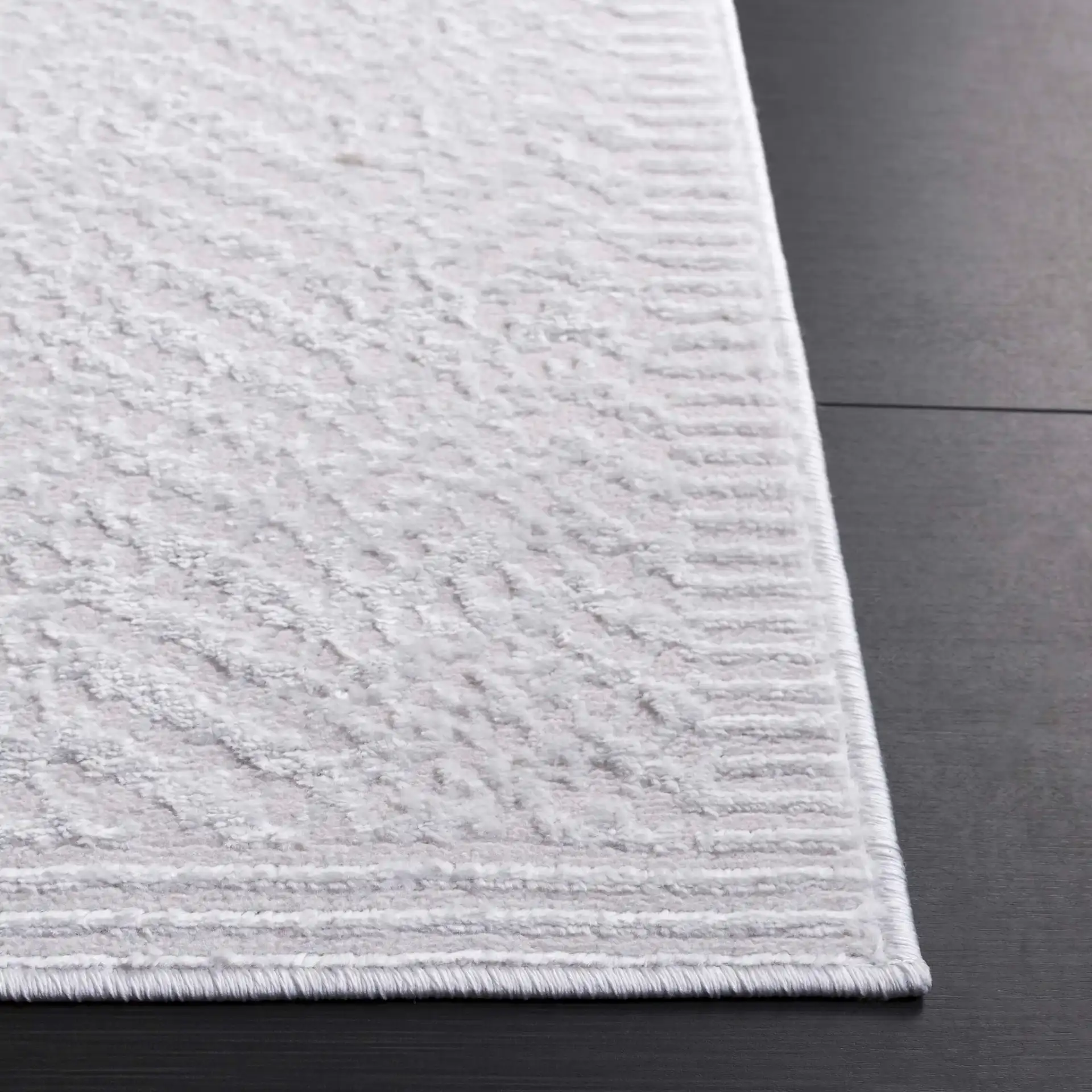 Saylor Chevron Border Rug in Ivory in a styled room
