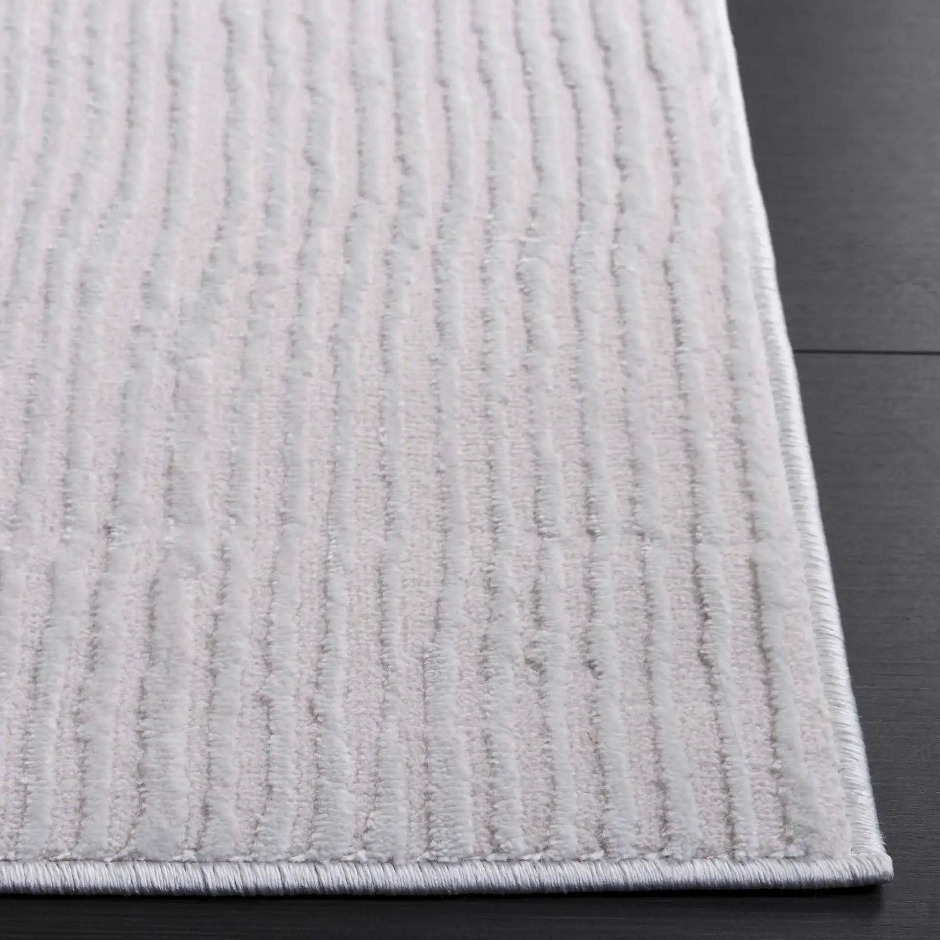 Saylor Ribbed Patchwork Rug in Ivory in a styled room