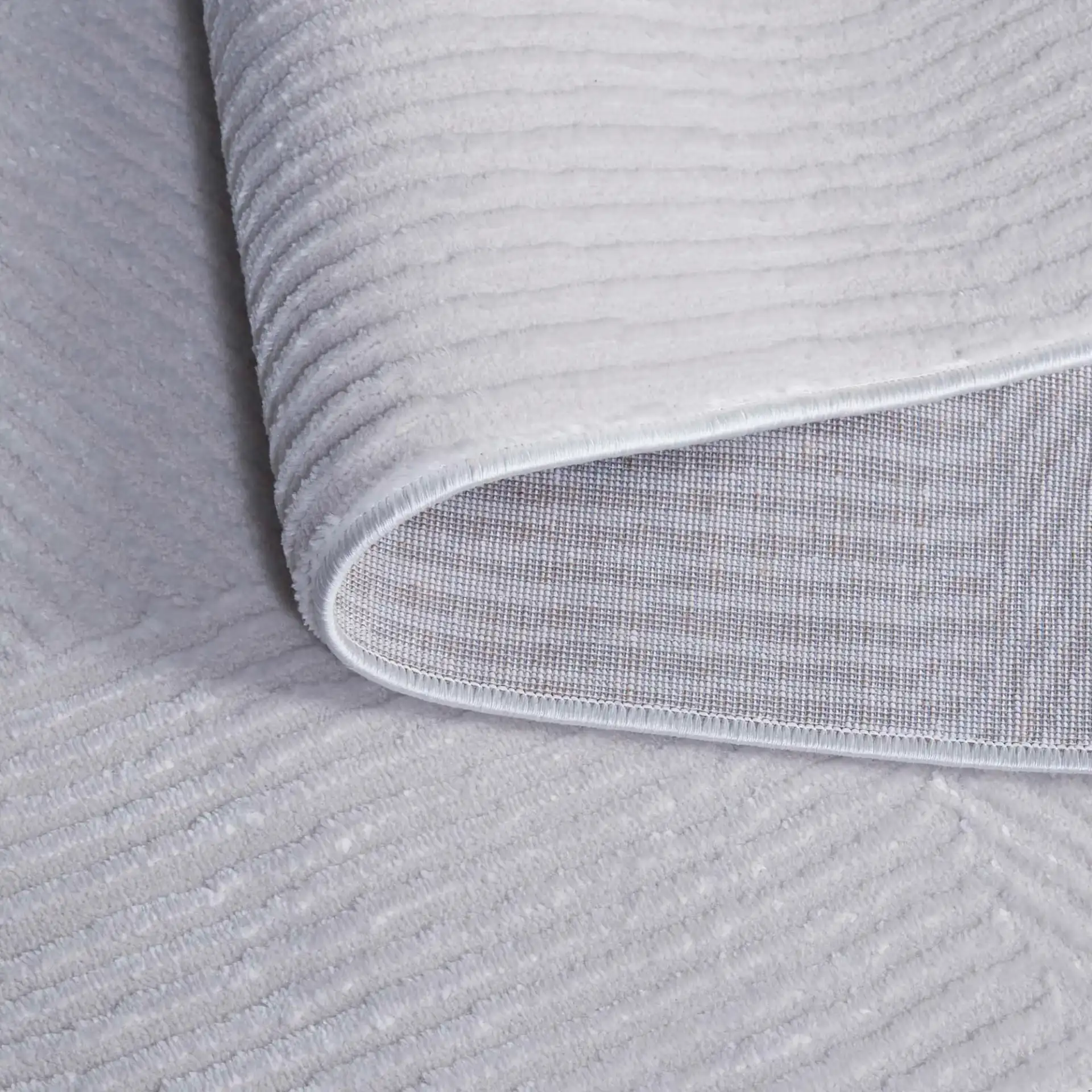 Saylor Ribbed Patchwork Rug in Ivory in a styled room