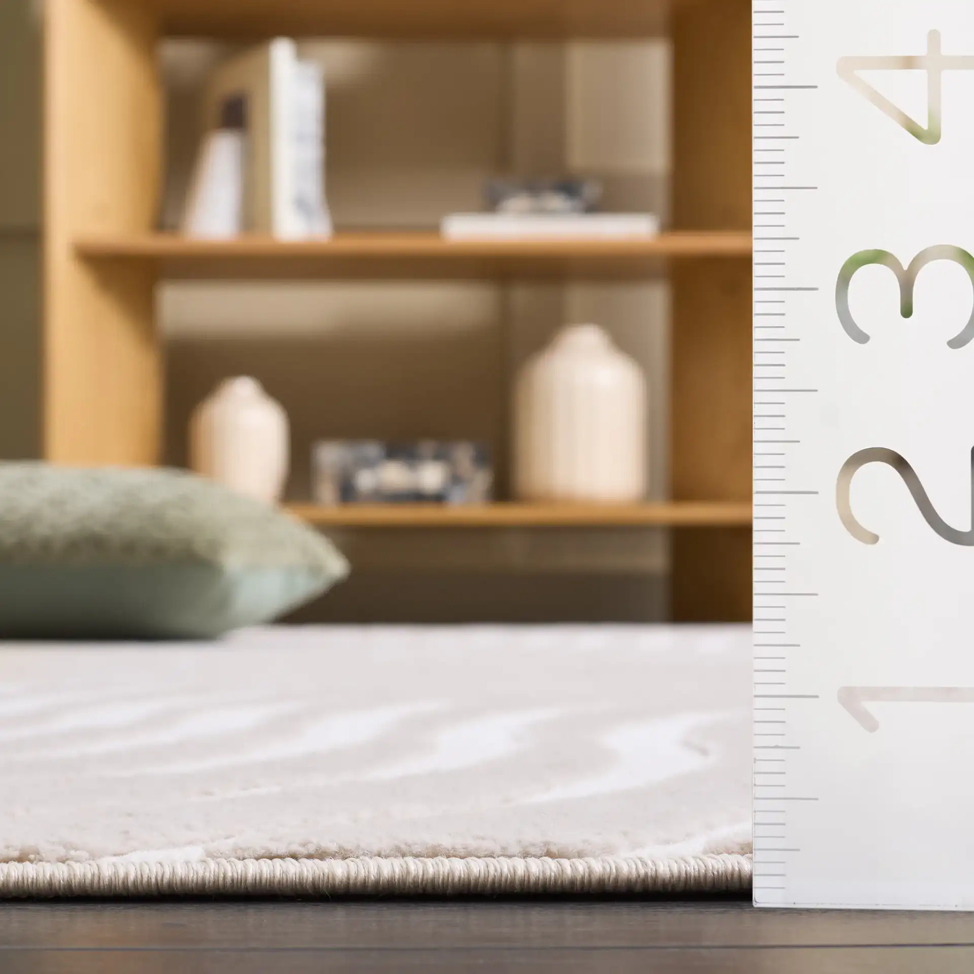 Saylor Wavy Stripe Rug in Beige / Ivory in a styled room