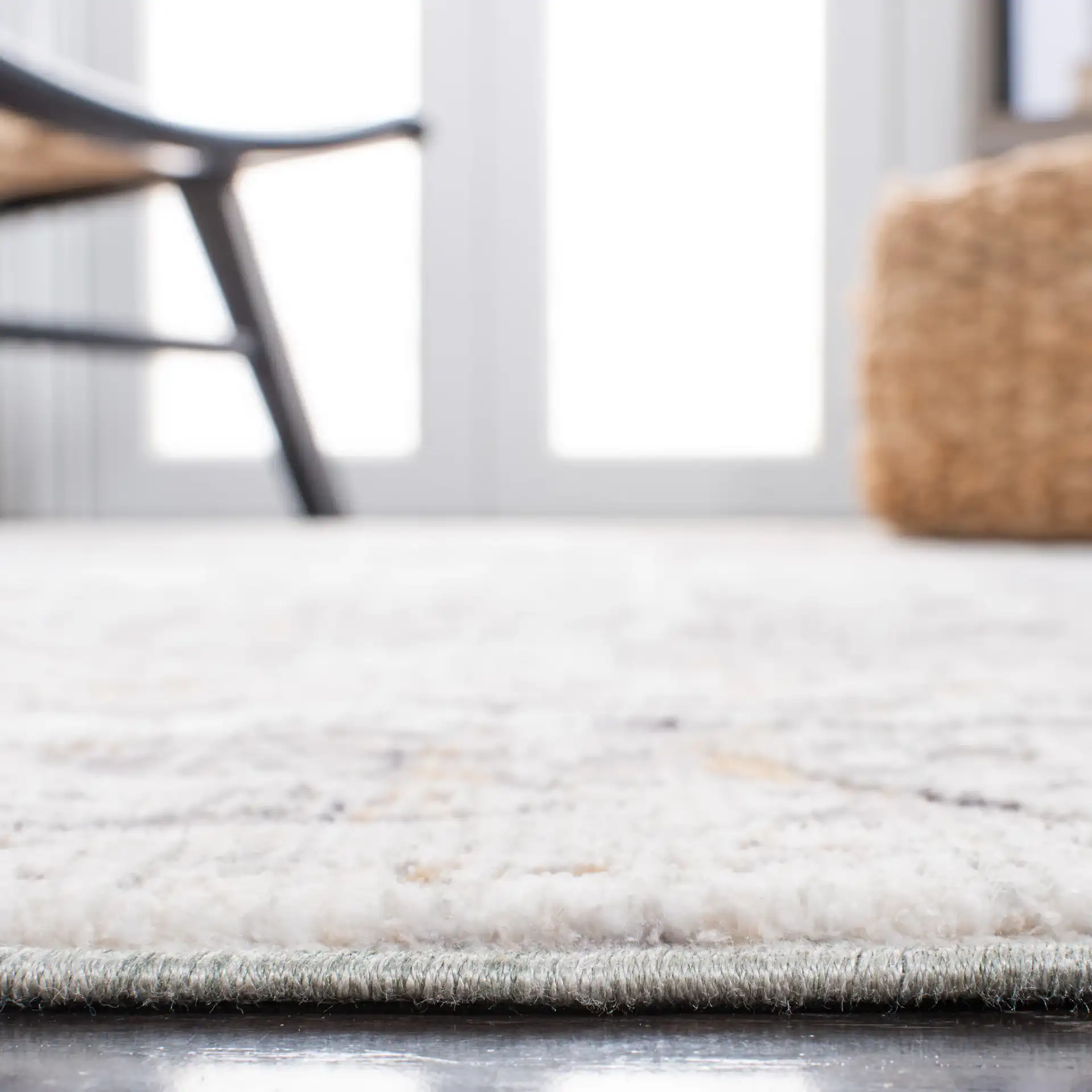 Sabrina Vintage Medallion Bordered Rug in Ivory / Light Gray in a styled room
