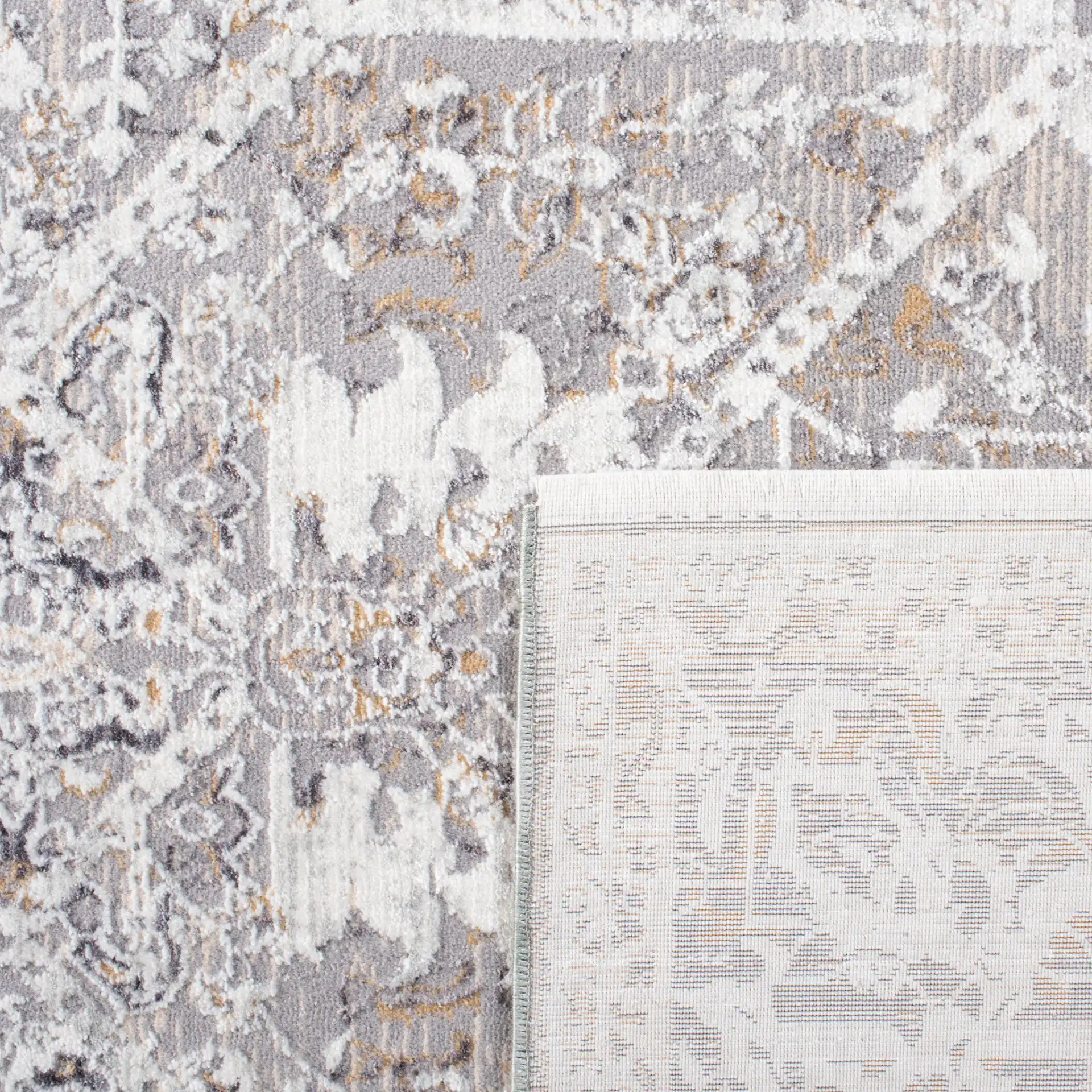 Sabrina Vintage Medallion Bordered Rug in Ivory / Light Gray in a styled room