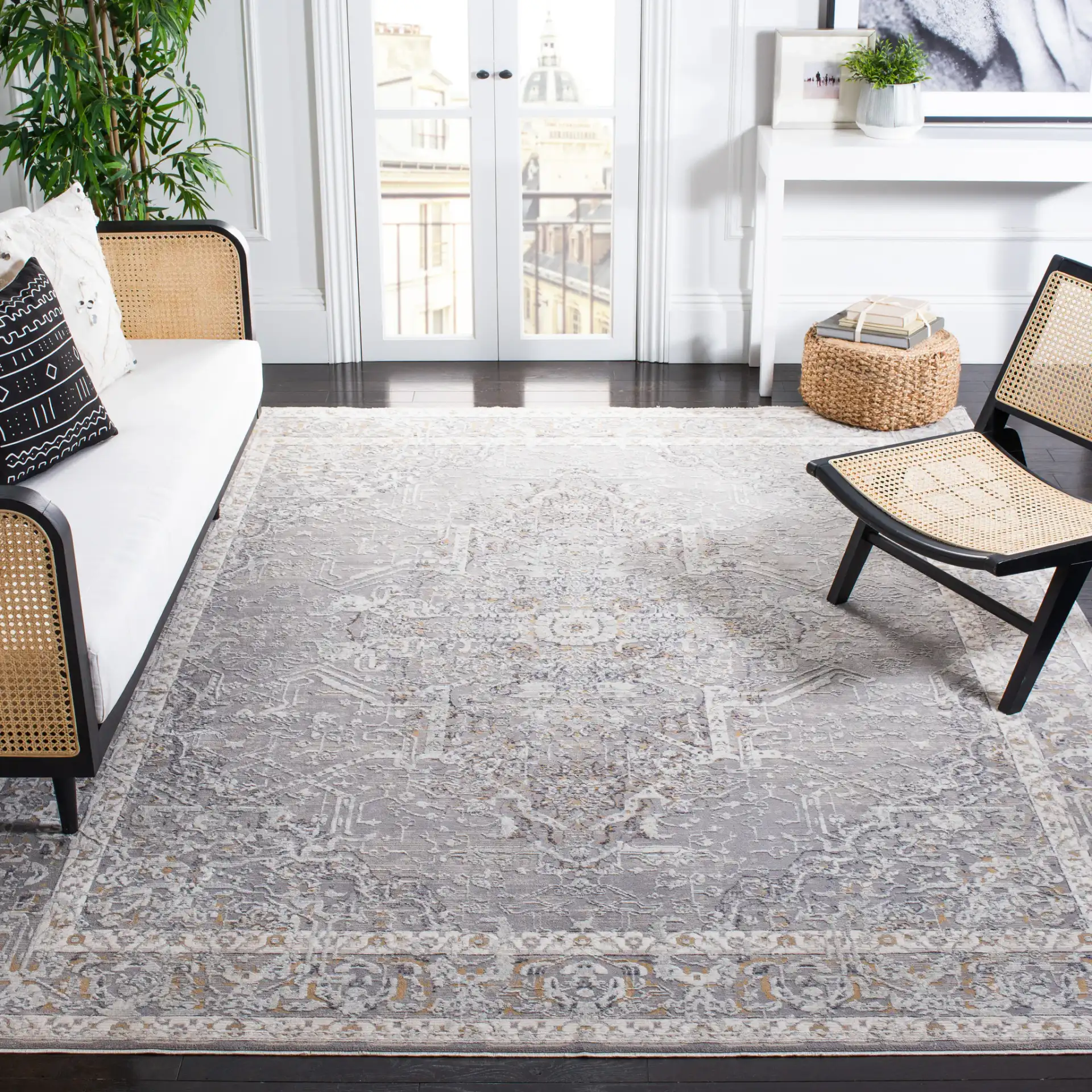 Sabrina Vintage Medallion Bordered Rug in Ivory / Light Gray in a styled room