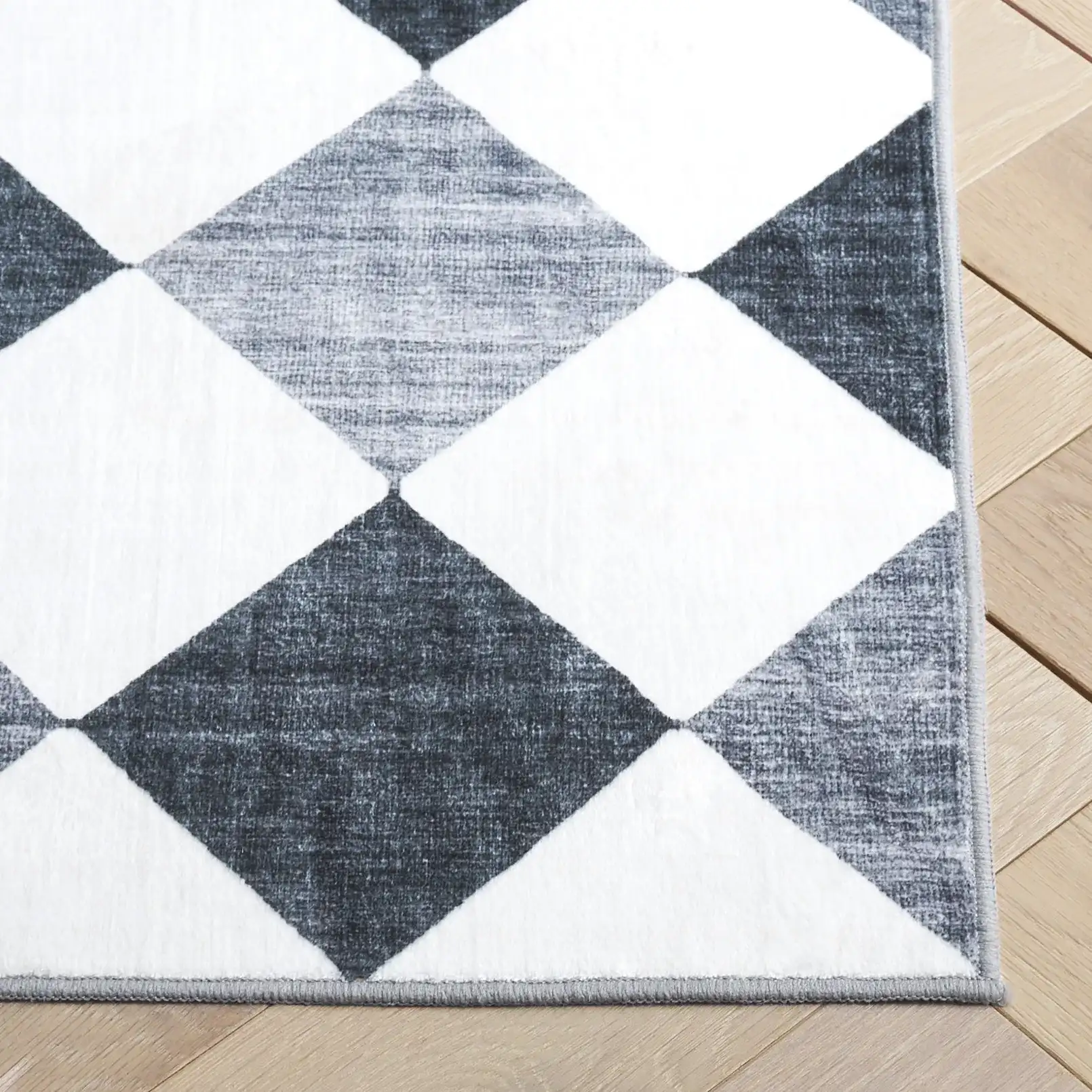 Santa Clara Diamond Washable Rug in Ivory / Gray Black in a styled room