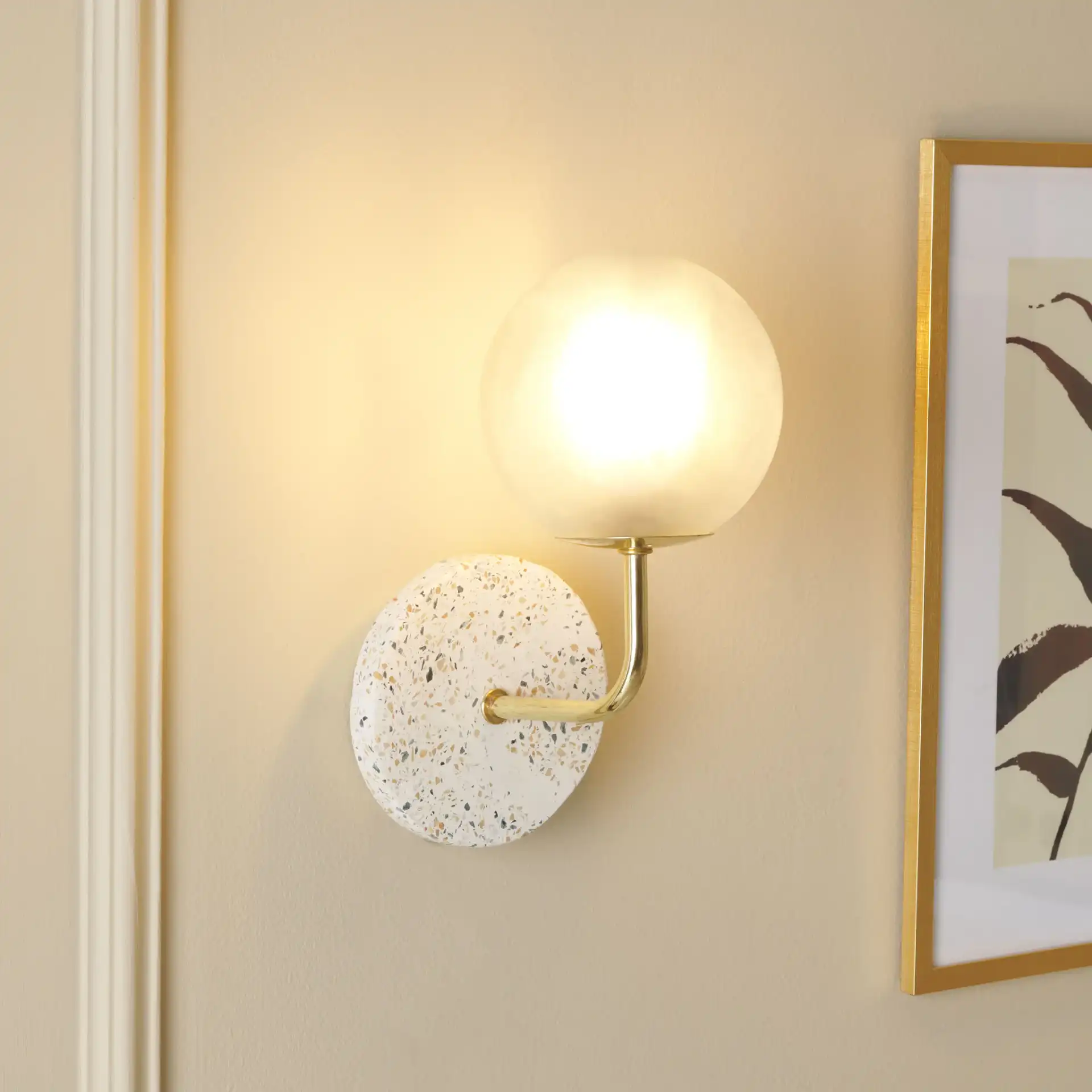 Nicolai Wall Sconce in White / Gold in a styled room