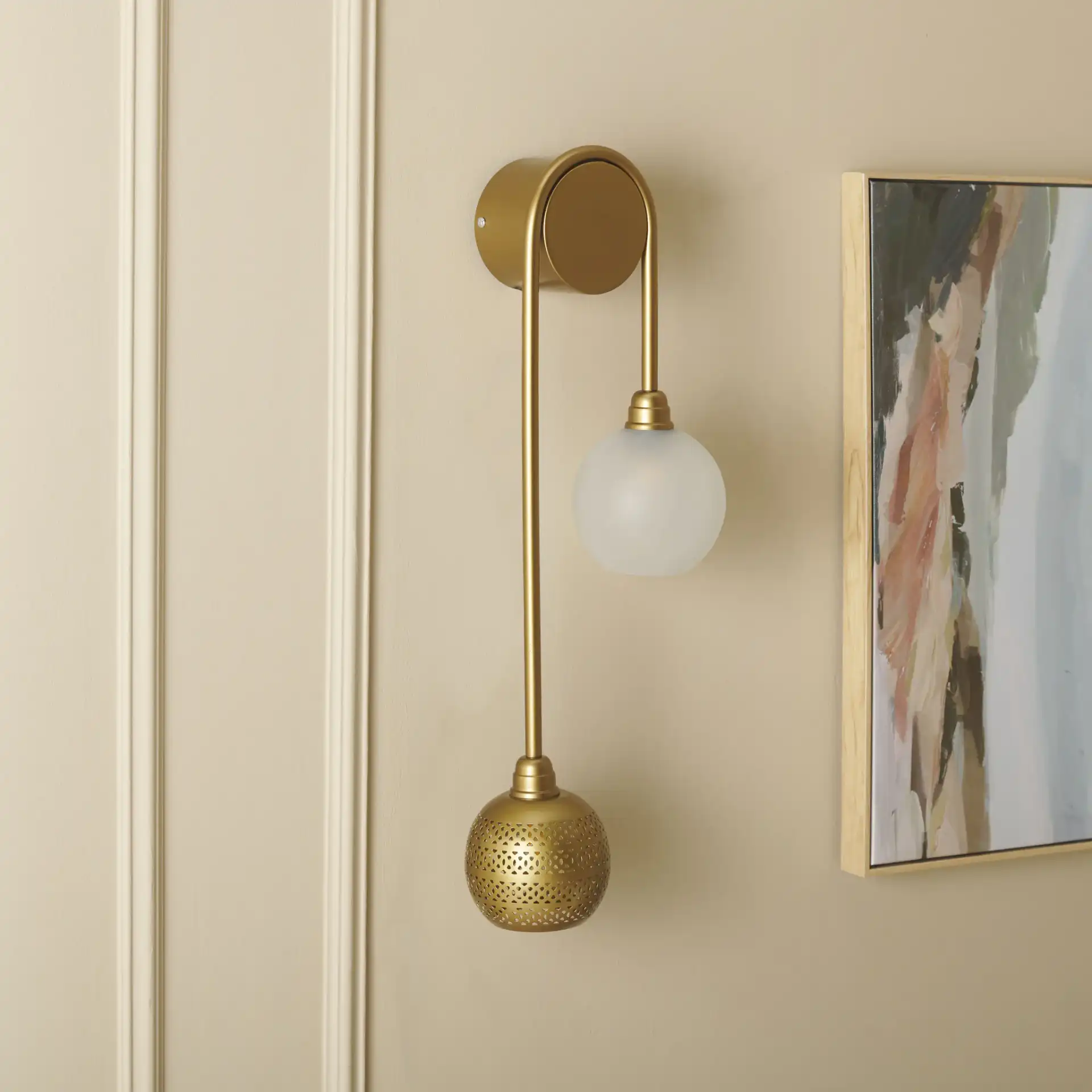 Amari Two-Light Wall Sconce in Antique Gold in a styled room