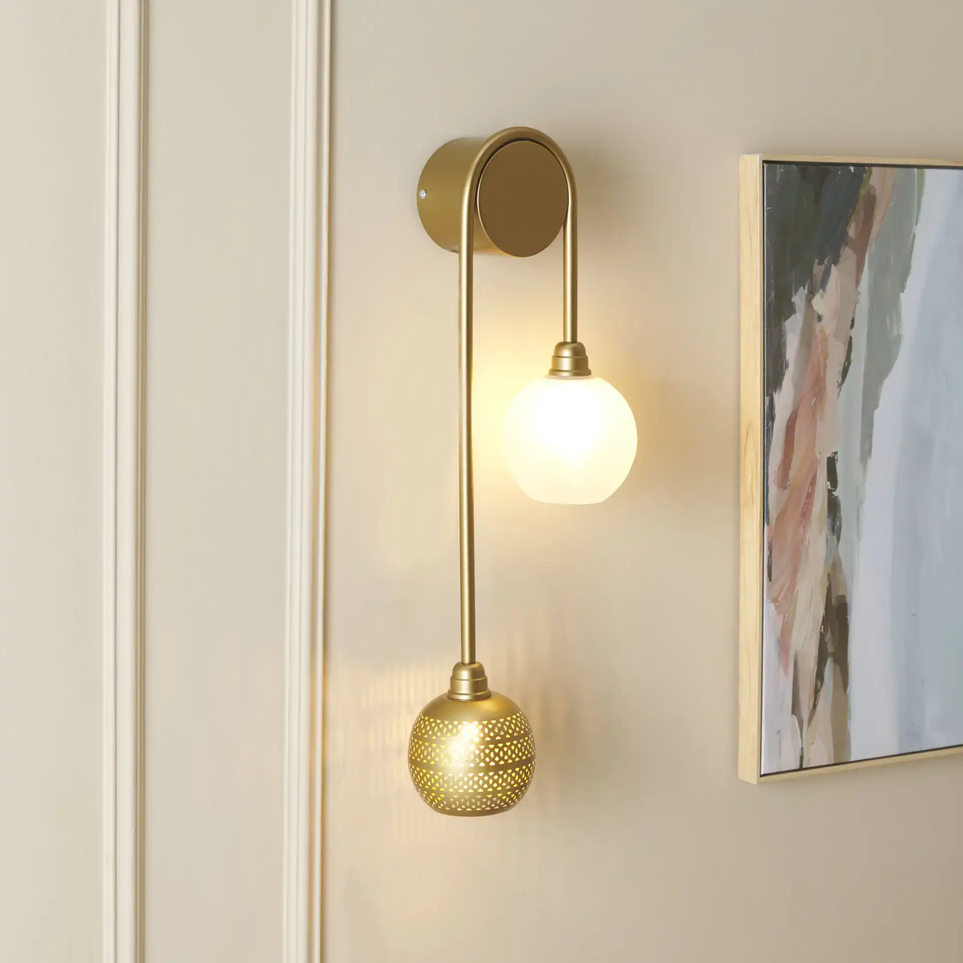 Amari Two-Light Wall Sconce in Antique Gold in a styled room