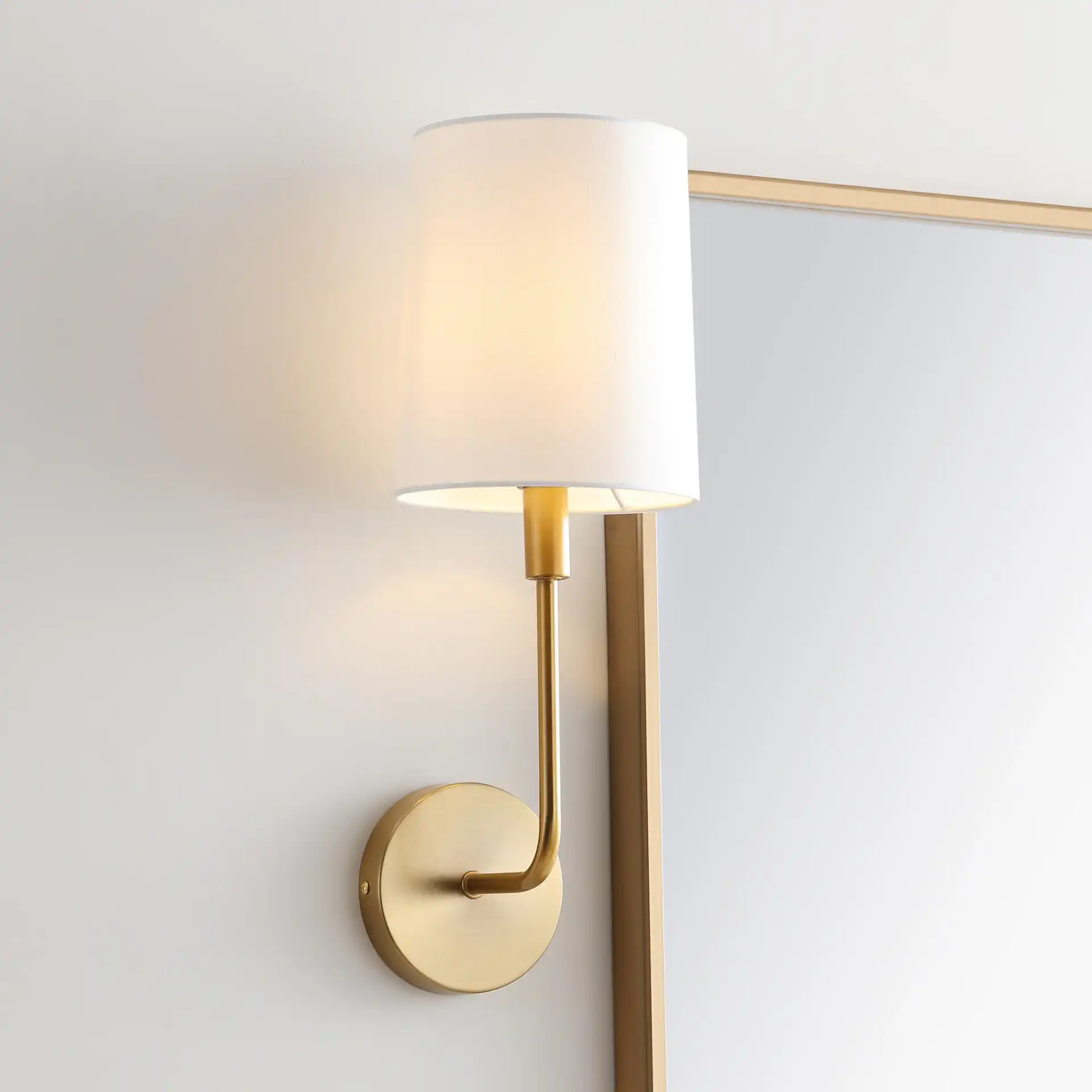 Jaxson Wall Sconce in Ivory / Gold in a styled room