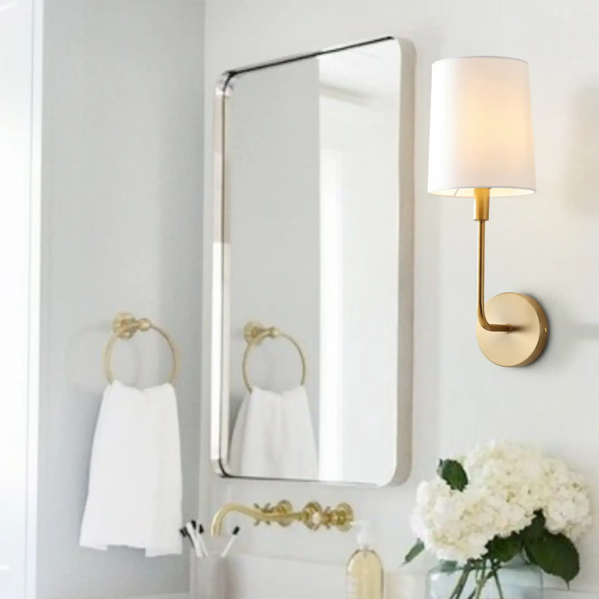 Jaxson Wall Sconce in Ivory / Gold in a styled room