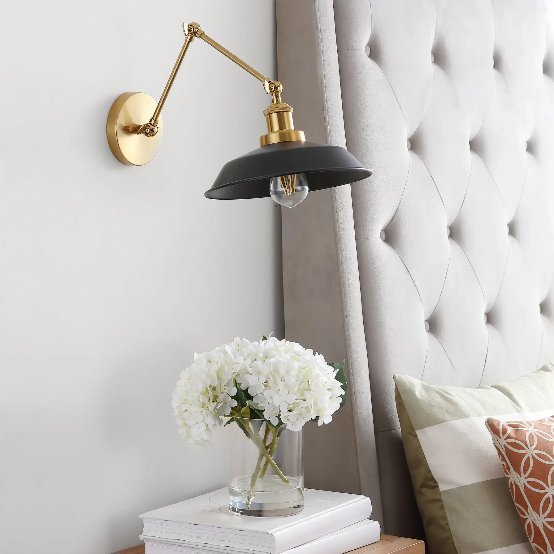 Kingston Wall Sconce in Brass / Black in a styled room