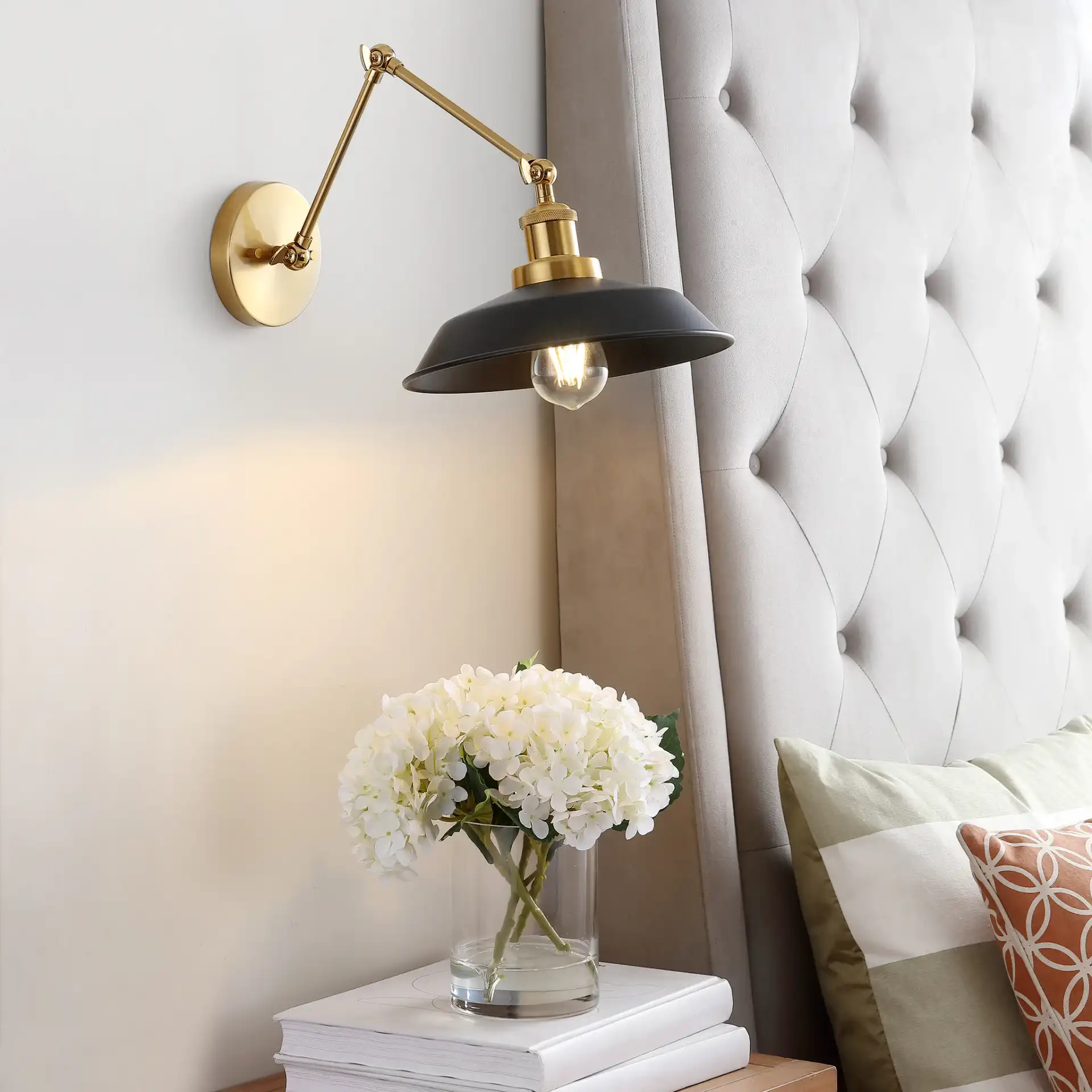 Kingston Wall Sconce in Brass / Black in a styled room