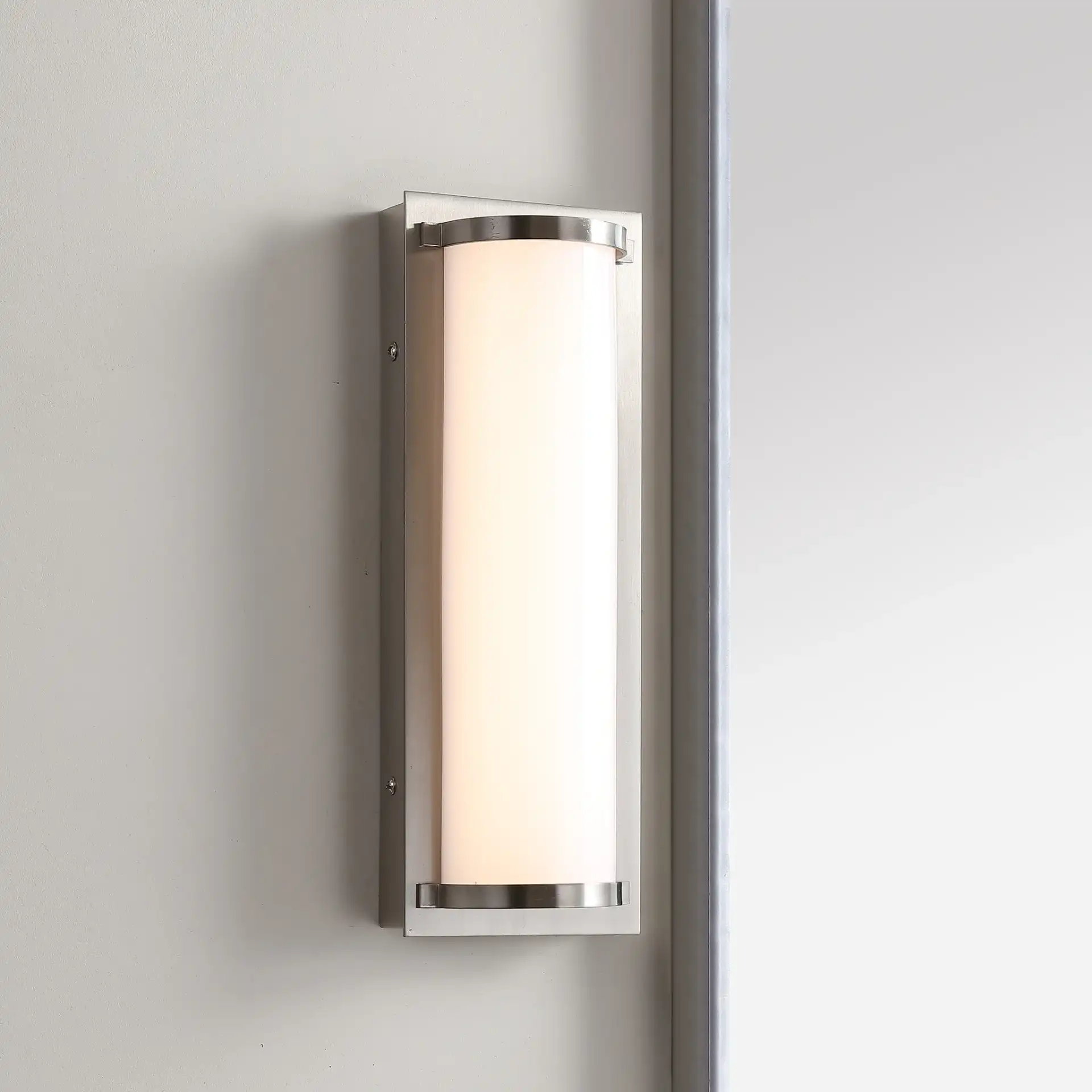 Luka Vanity Bar Sconce in Bronze in a styled room