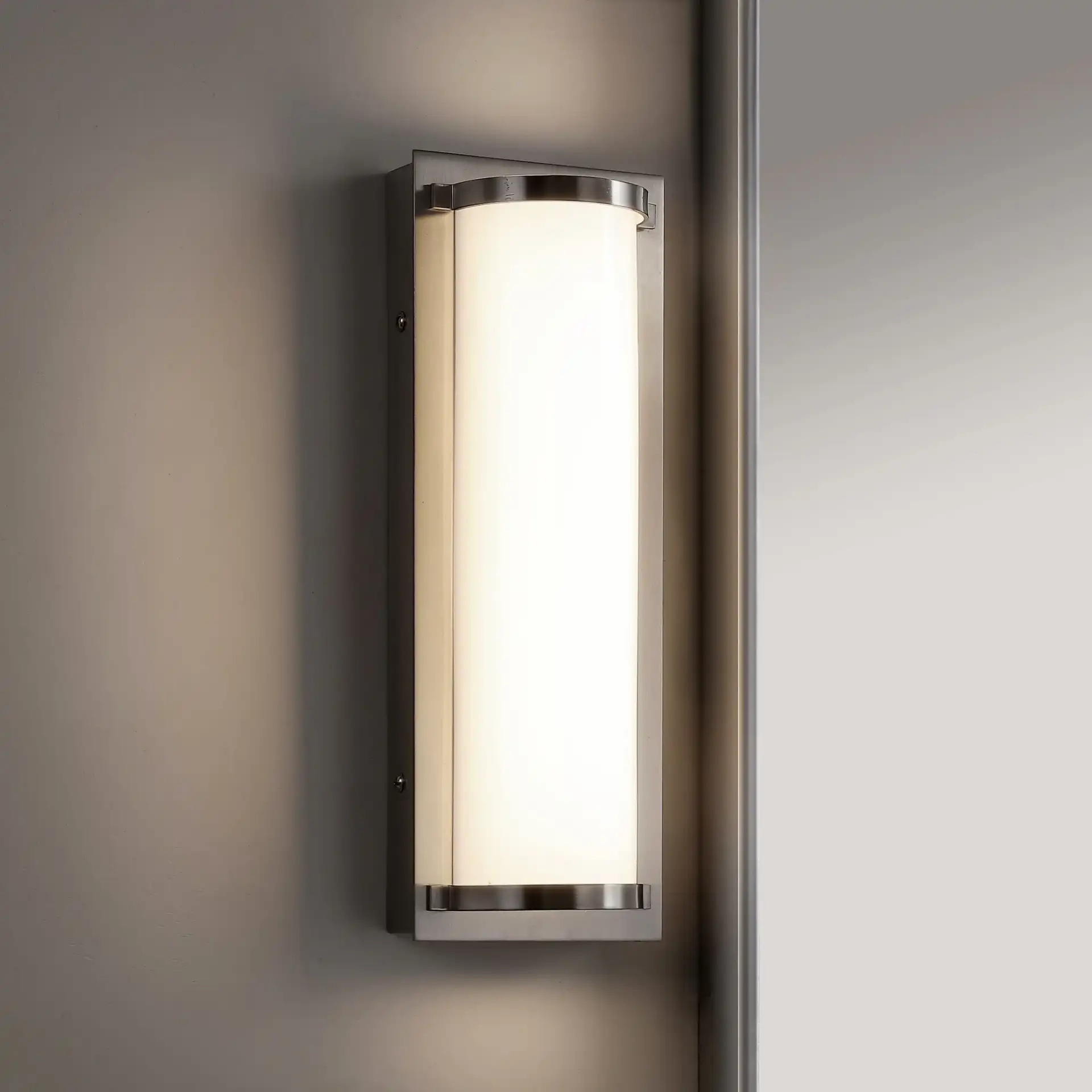 Luka Vanity Bar Sconce in Bronze in a styled room