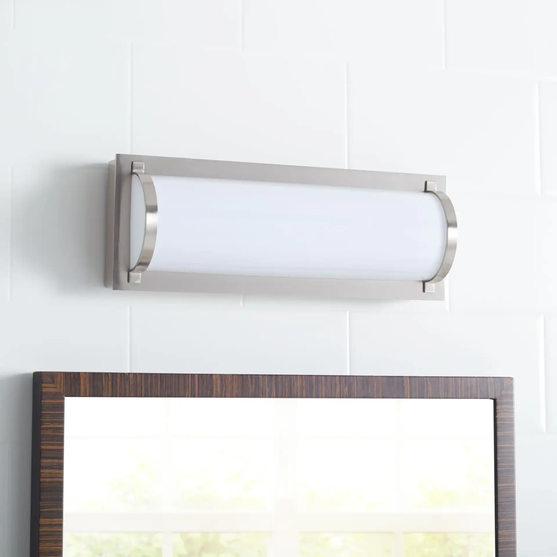 Luka Vanity Bar Sconce in Bronze in a styled room