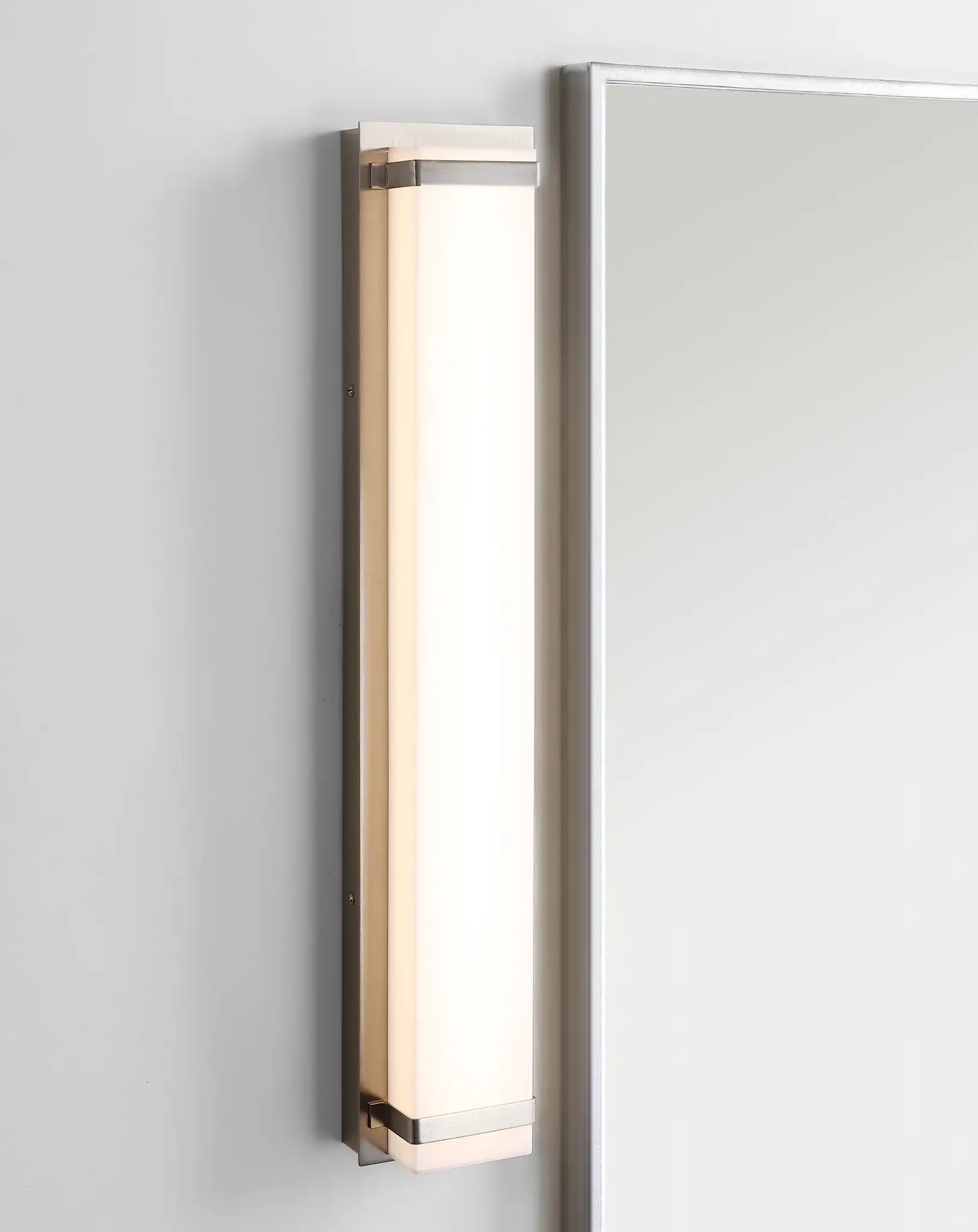Gannon Vanity Bar Sconce in Bronze in a styled room