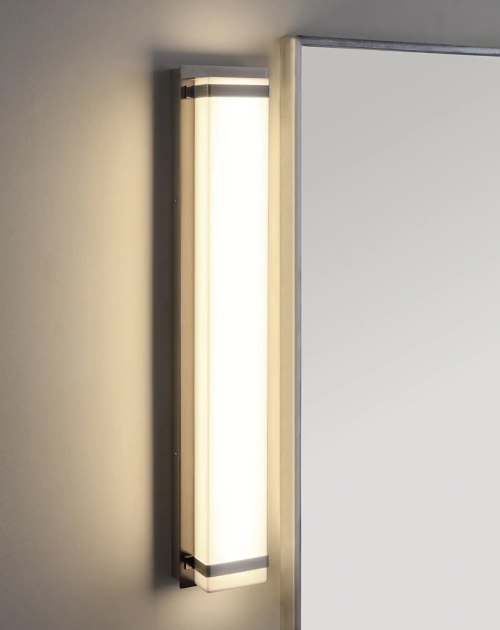 Gannon Vanity Bar Sconce in Bronze in a styled room