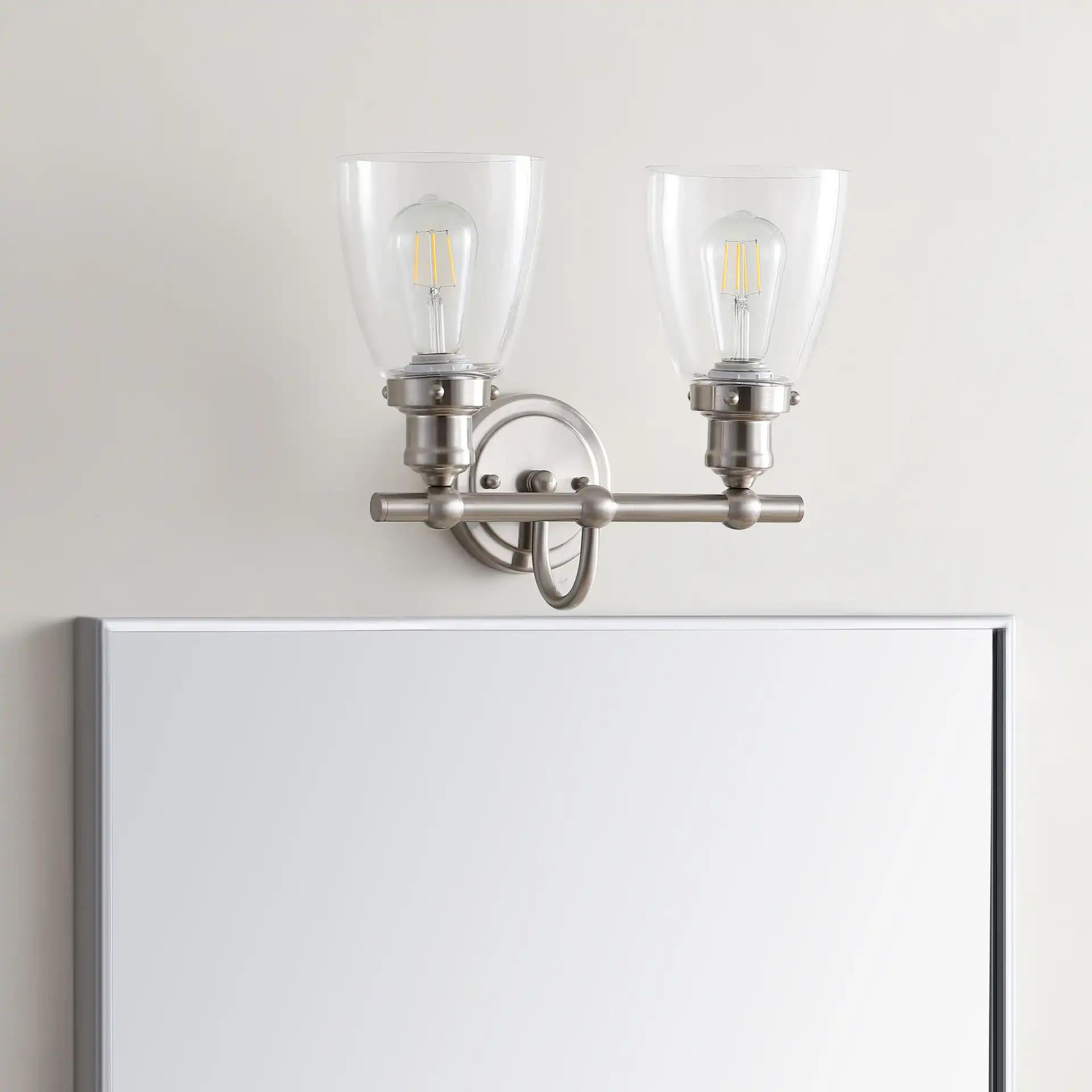 Layton Two-Light Sconce in Bronze in a styled room