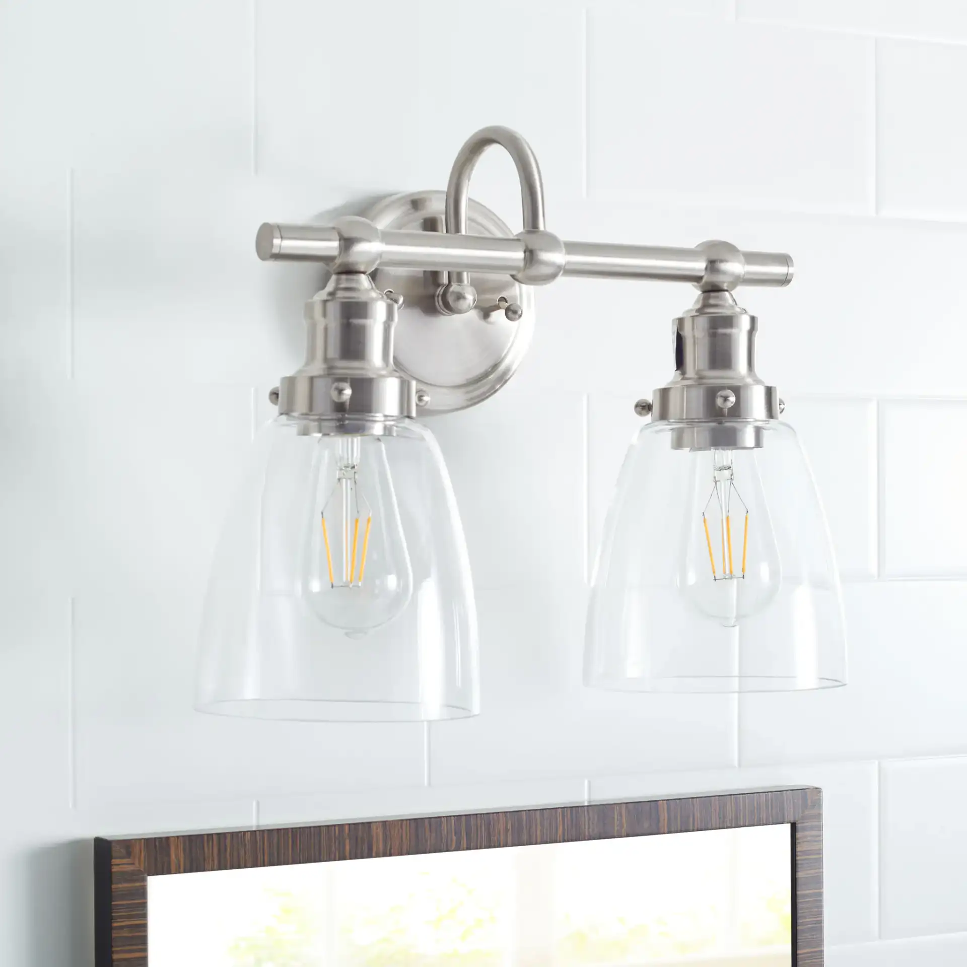 Layton Two-Light Sconce in Bronze in a styled room