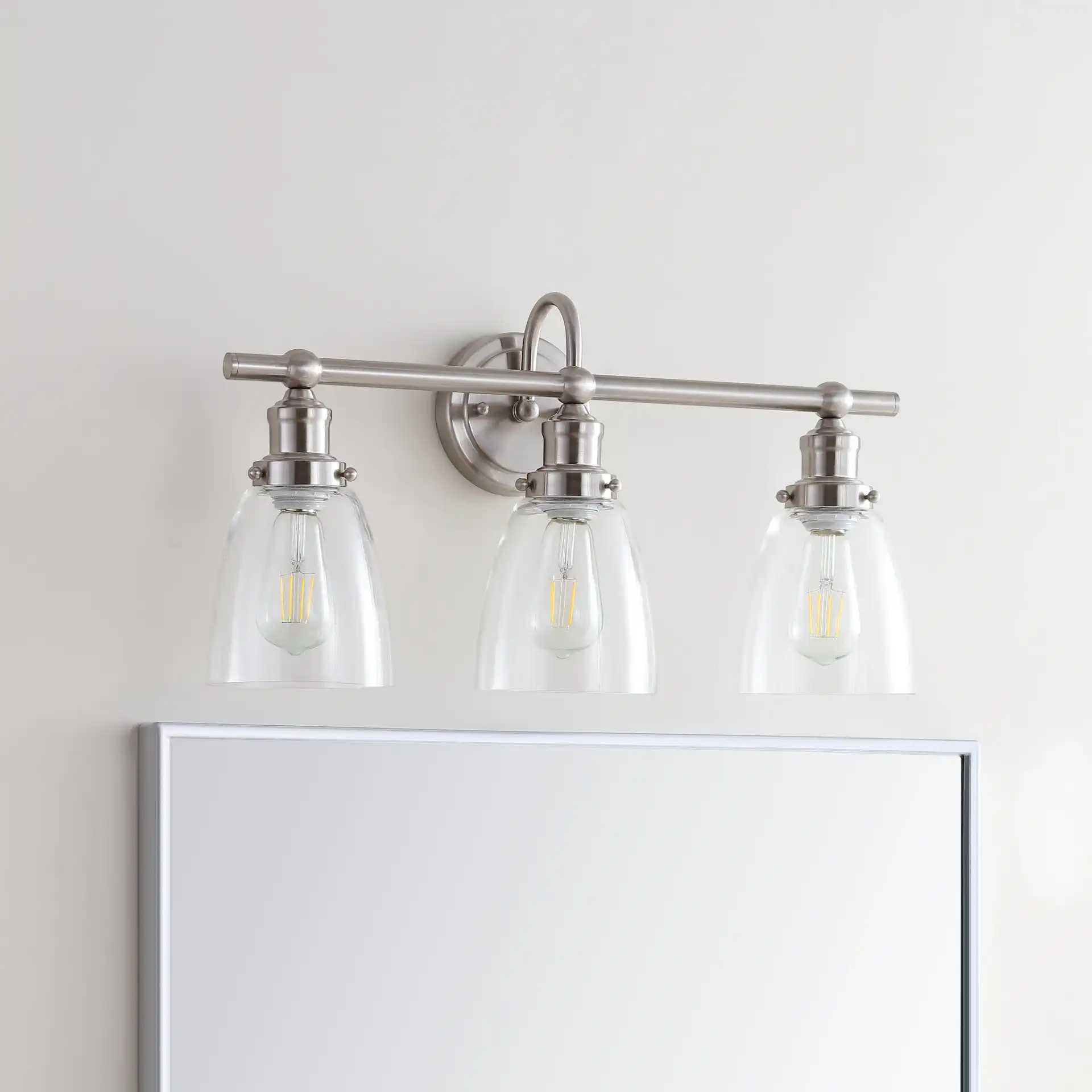 Dunes Three-Light Sconce in Natural Rattan in a styled room