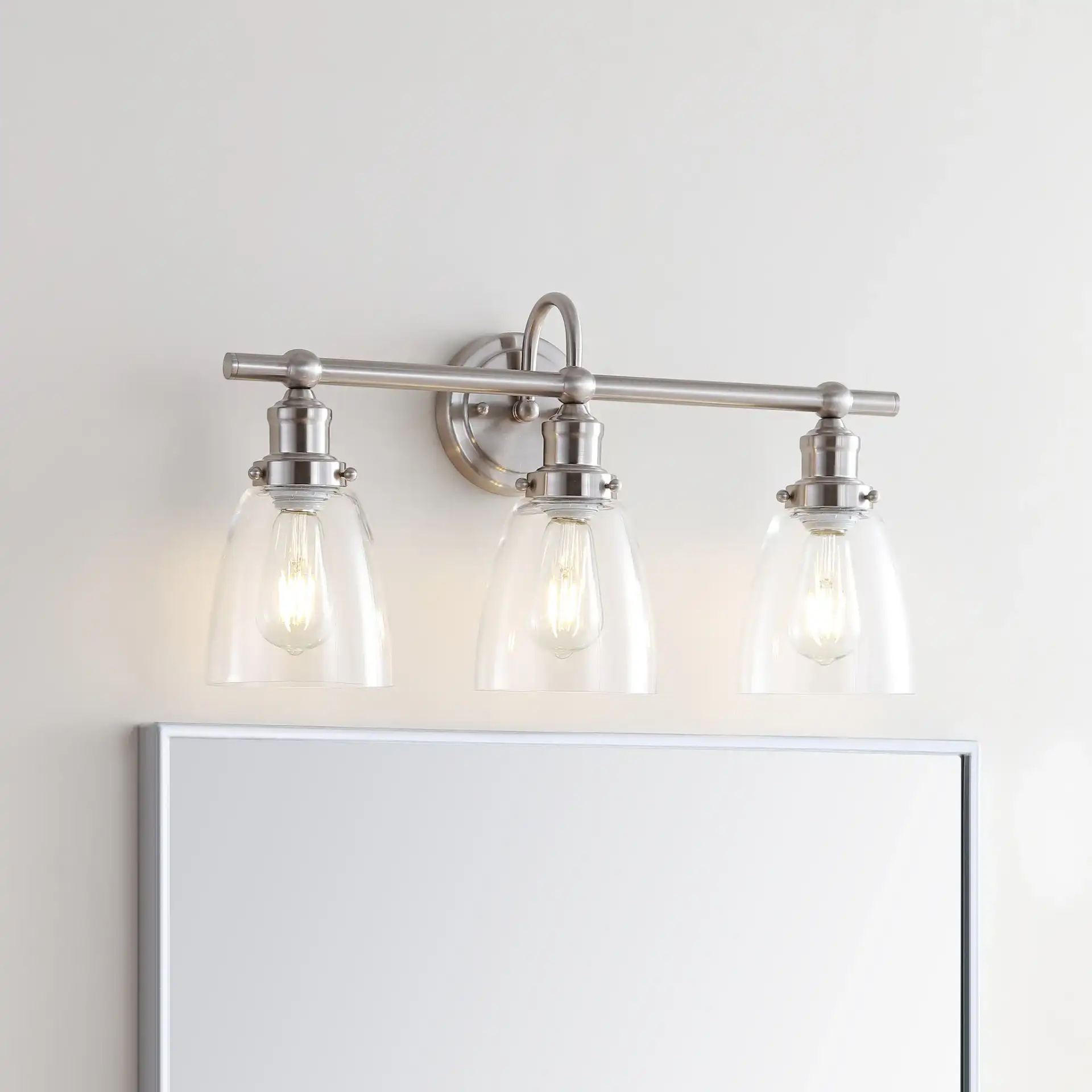 Dunes Three-Light Sconce in Natural Rattan in a styled room