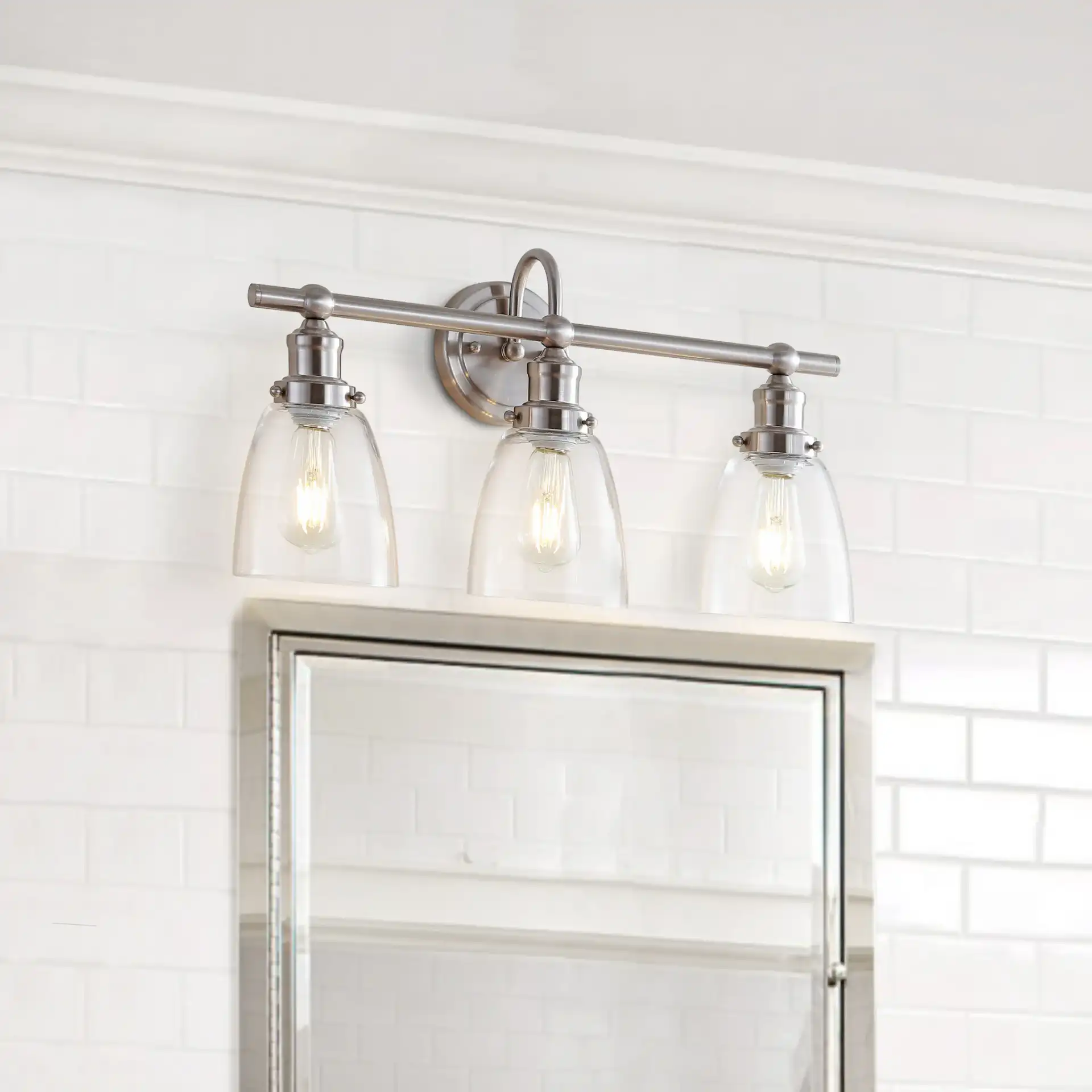Dunes Three-Light Sconce in Natural Rattan in a styled room