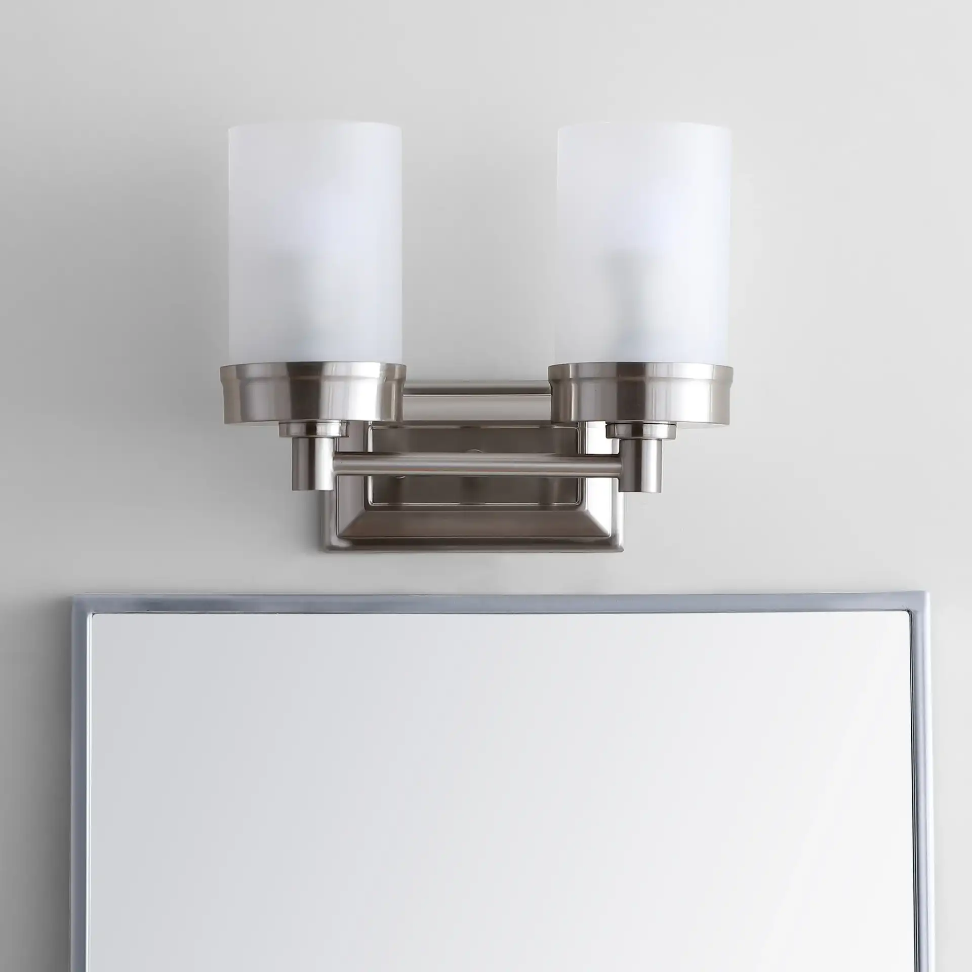 Kylan Two-Light Sconce in Nickel in a styled room