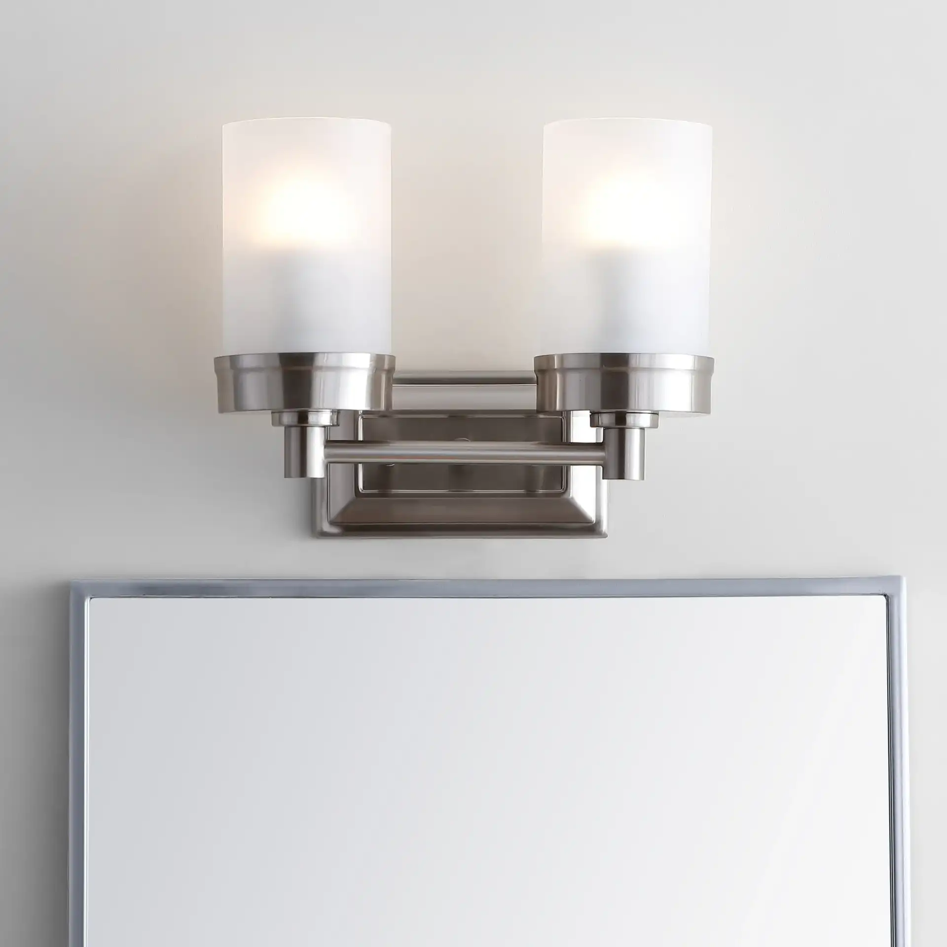 Kylan Two-Light Sconce in Nickel in a styled room