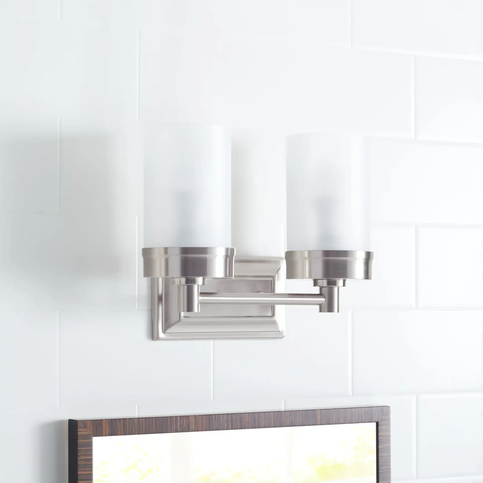 Kylan Two-Light Sconce in Nickel in a styled room
