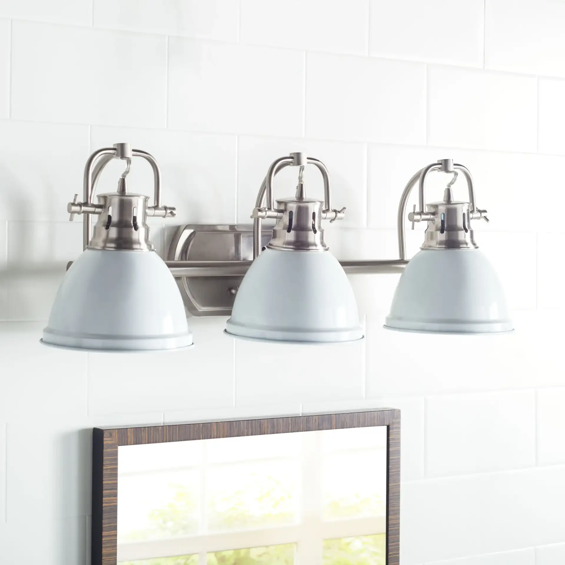 Roland Three-Light Sconce in Nickel in a styled room
