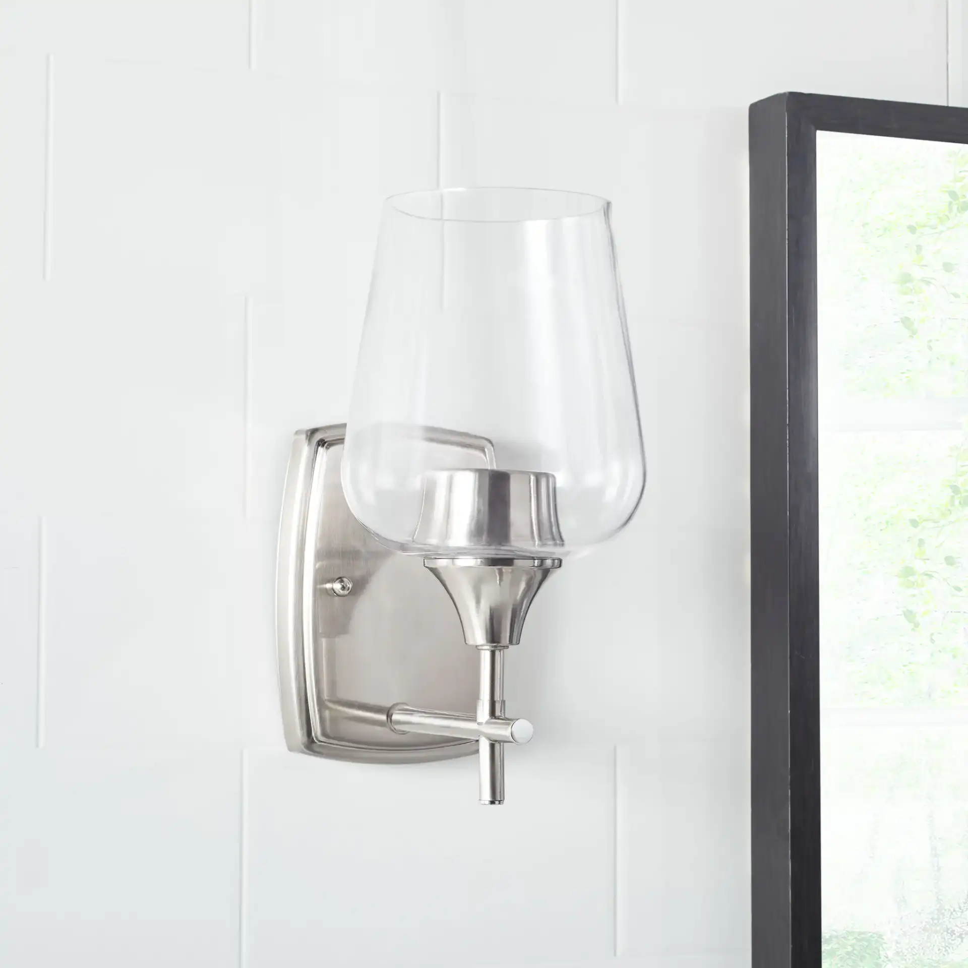 Valda Wall Sconce in Nickel / Clear in a styled room