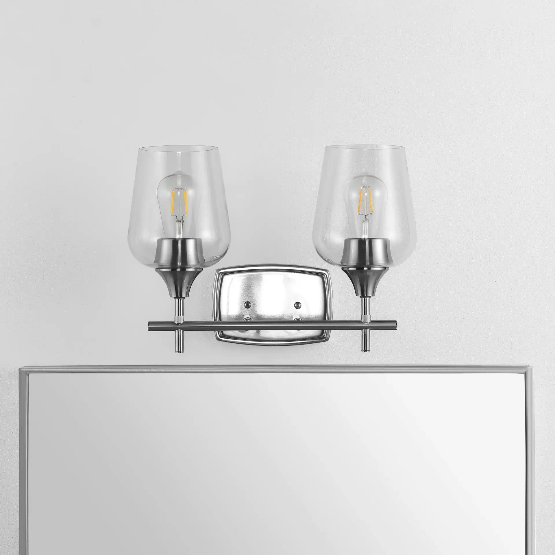 Tage Wall Sconce in Nickel / Clear in a styled room
