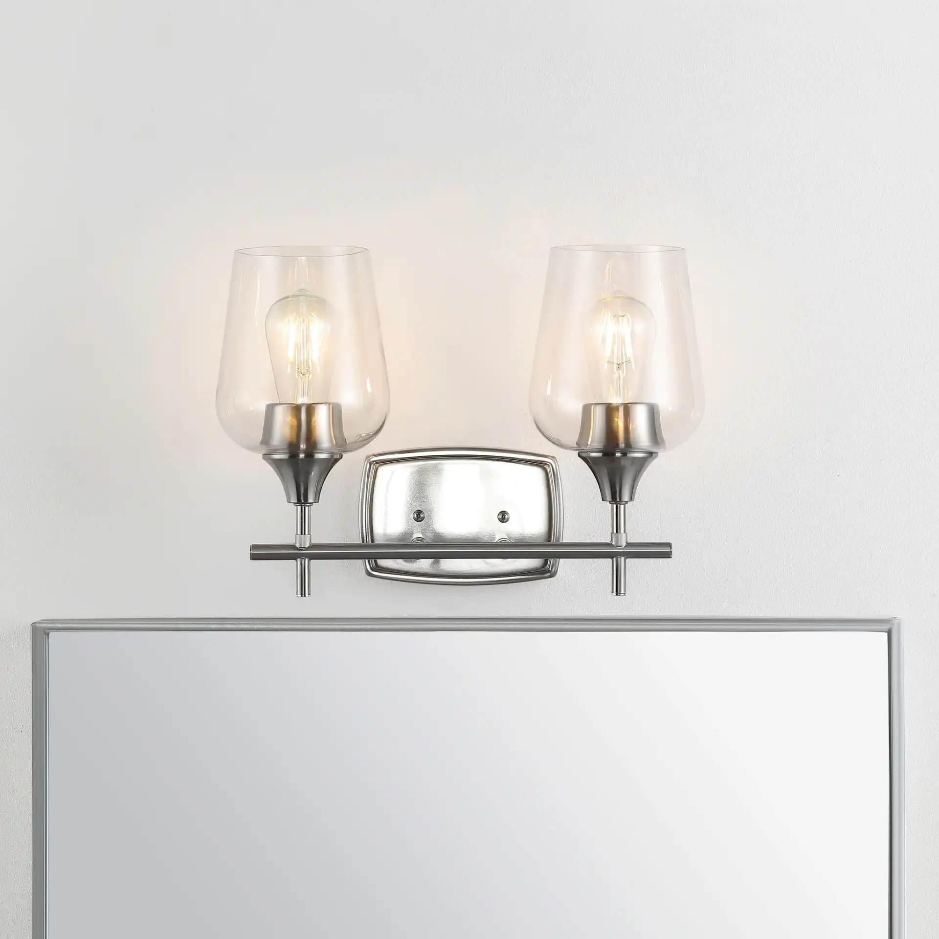 Tage Wall Sconce in Nickel / Clear in a styled room