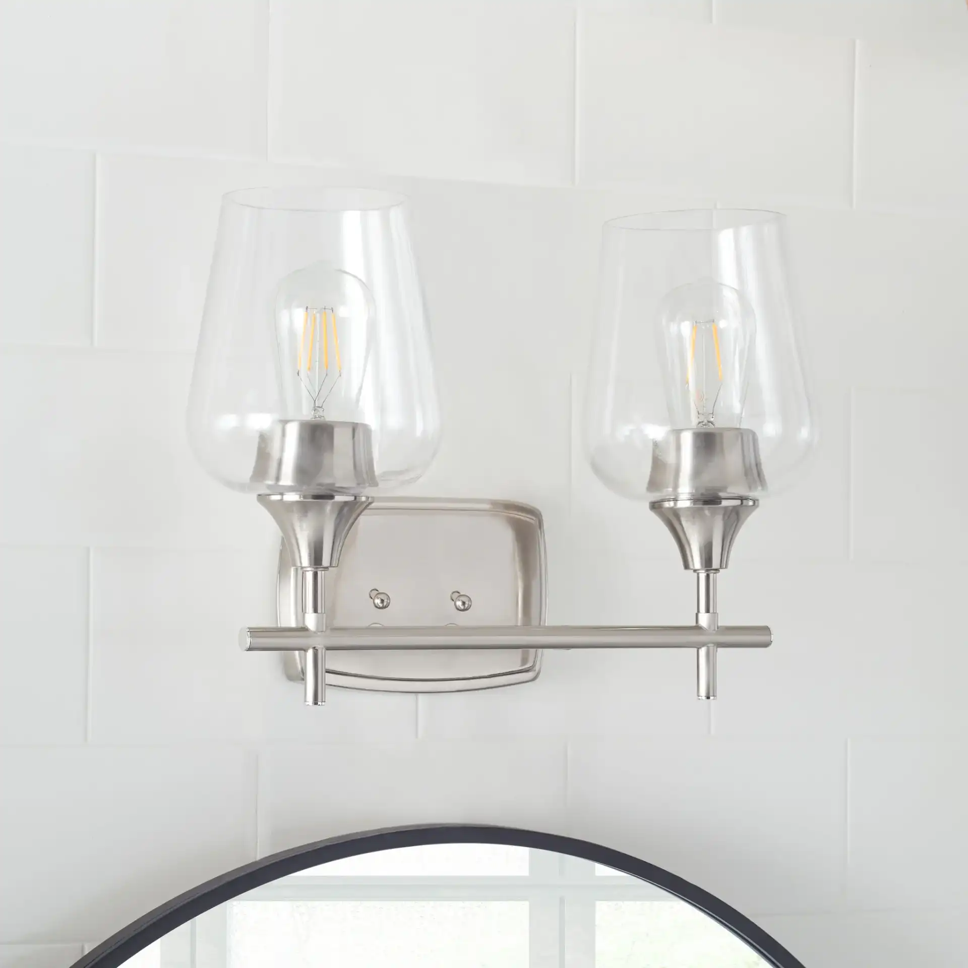 Tage Wall Sconce in Nickel / Clear in a styled room