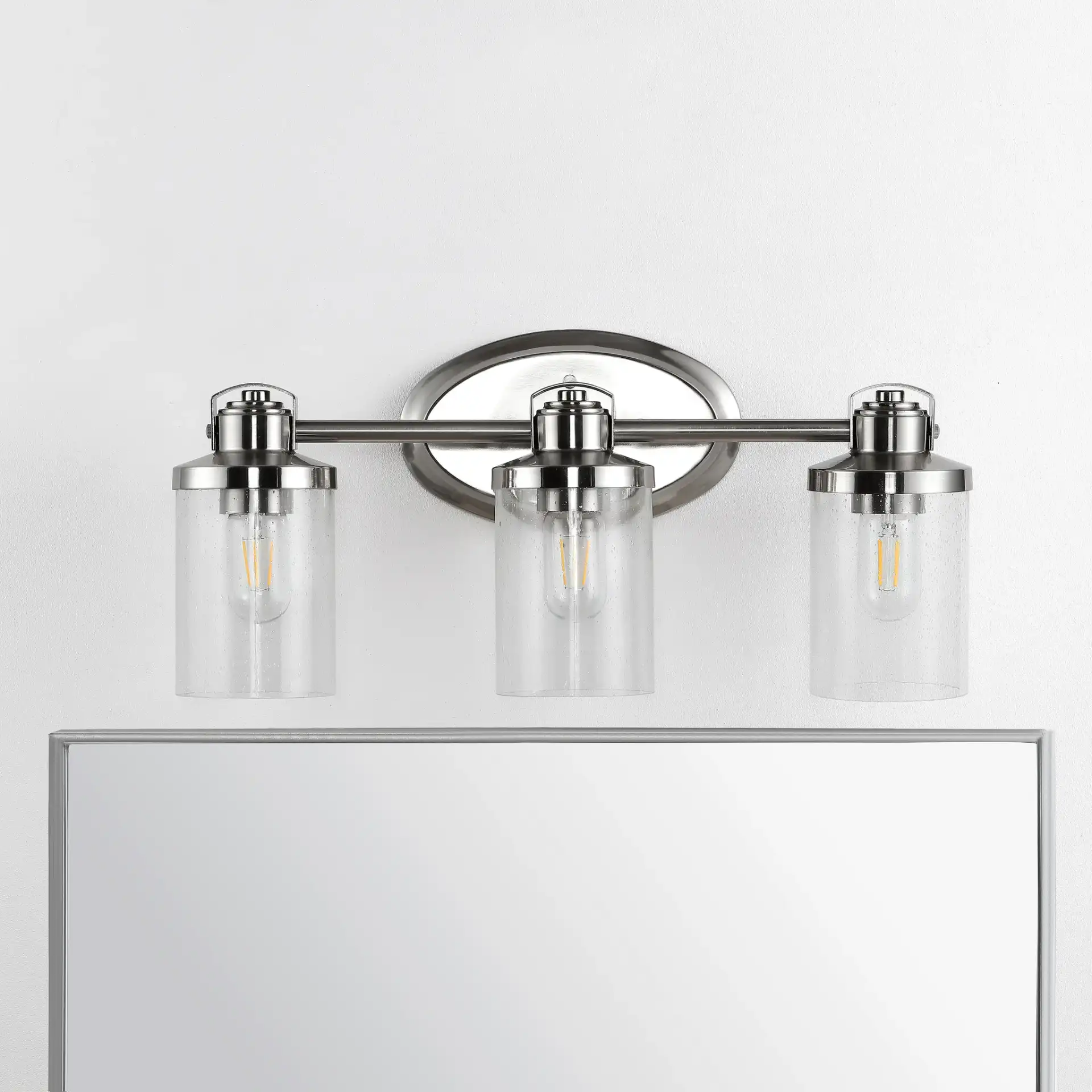 Maci Wall Sconce in Bronze in a styled room