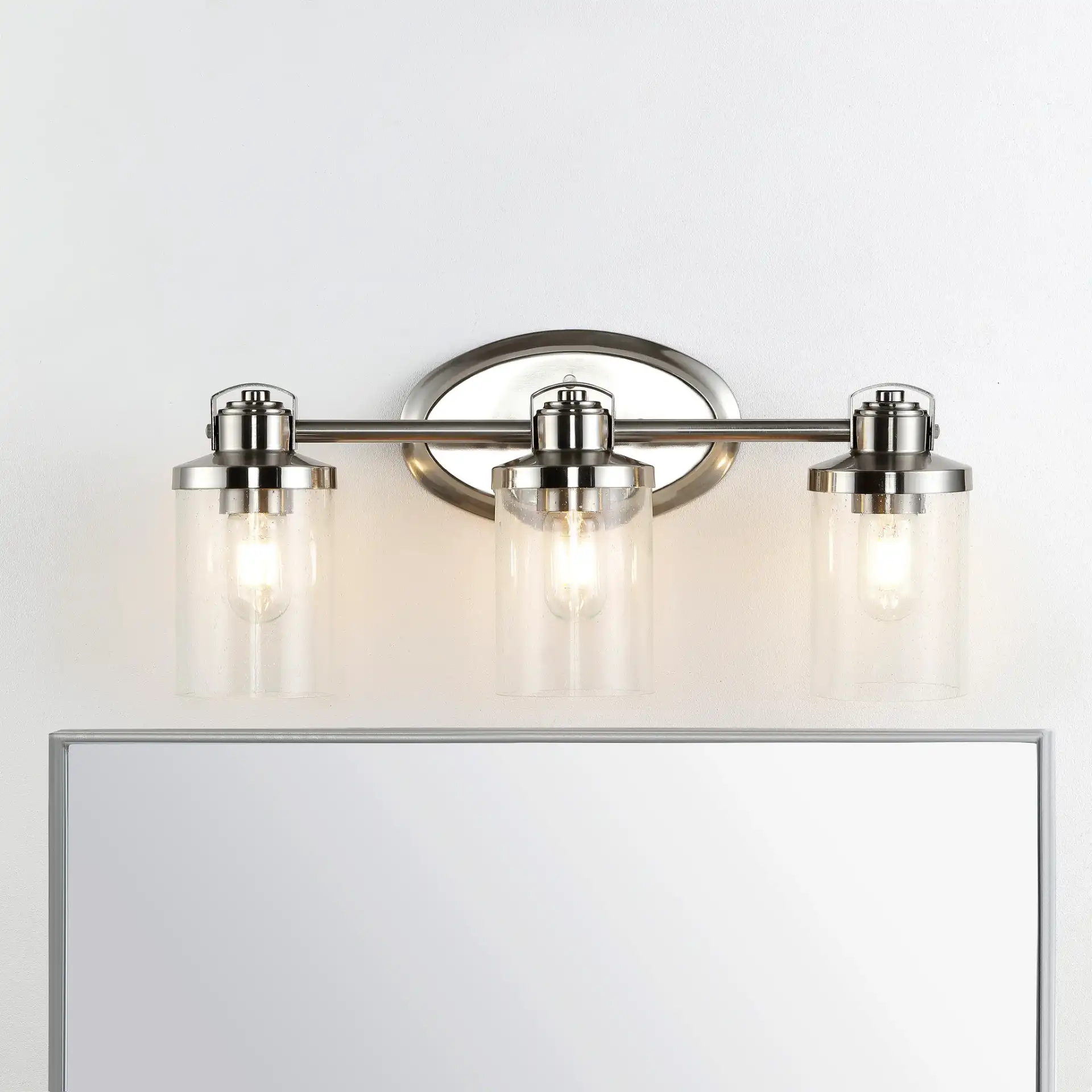 Maci Wall Sconce in Bronze in a styled room