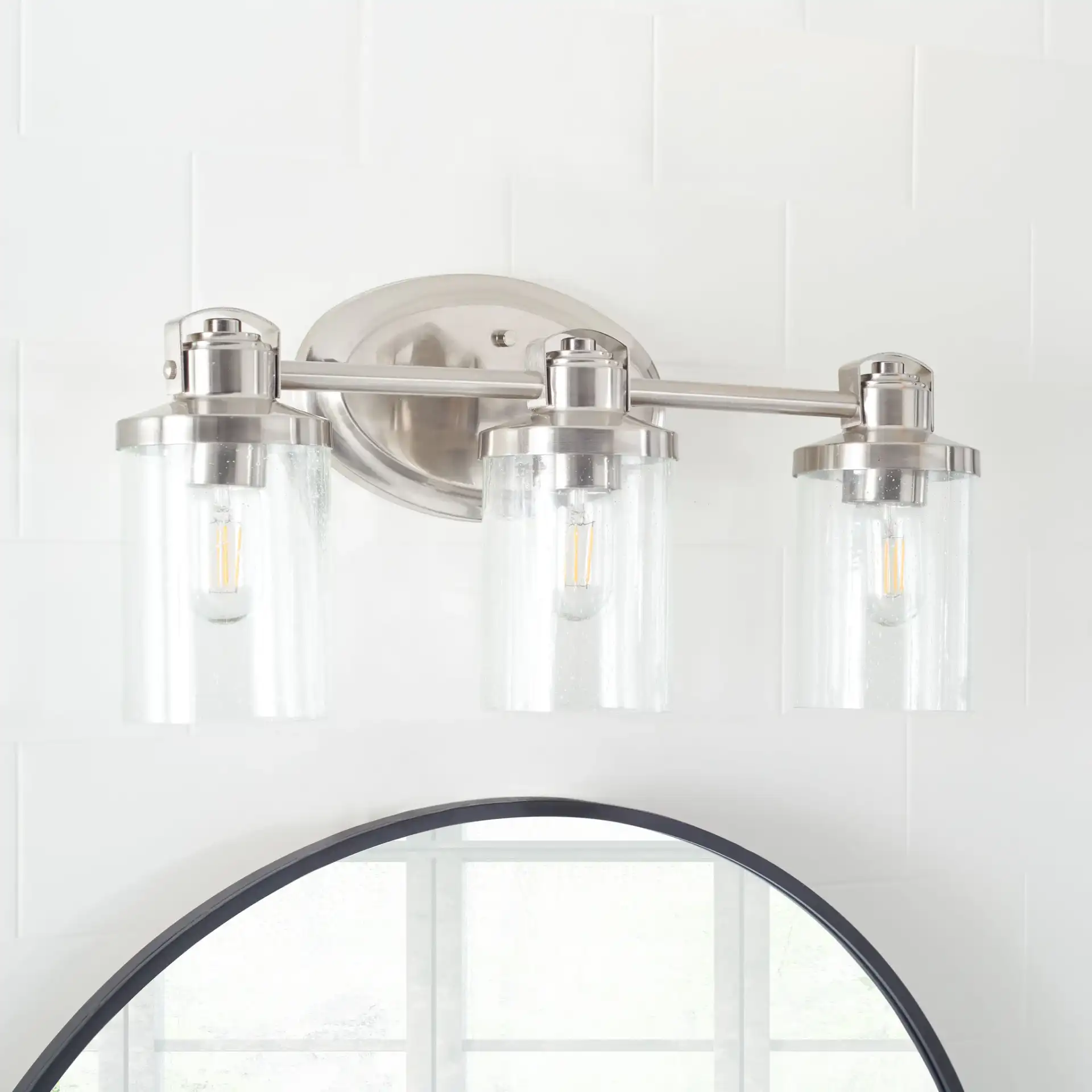Maci Wall Sconce in Bronze in a styled room