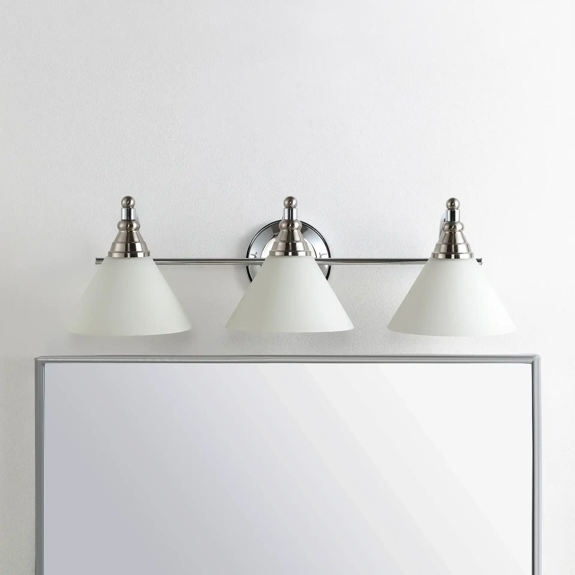 Panya Wall Sconce in Nickel / White in a styled room