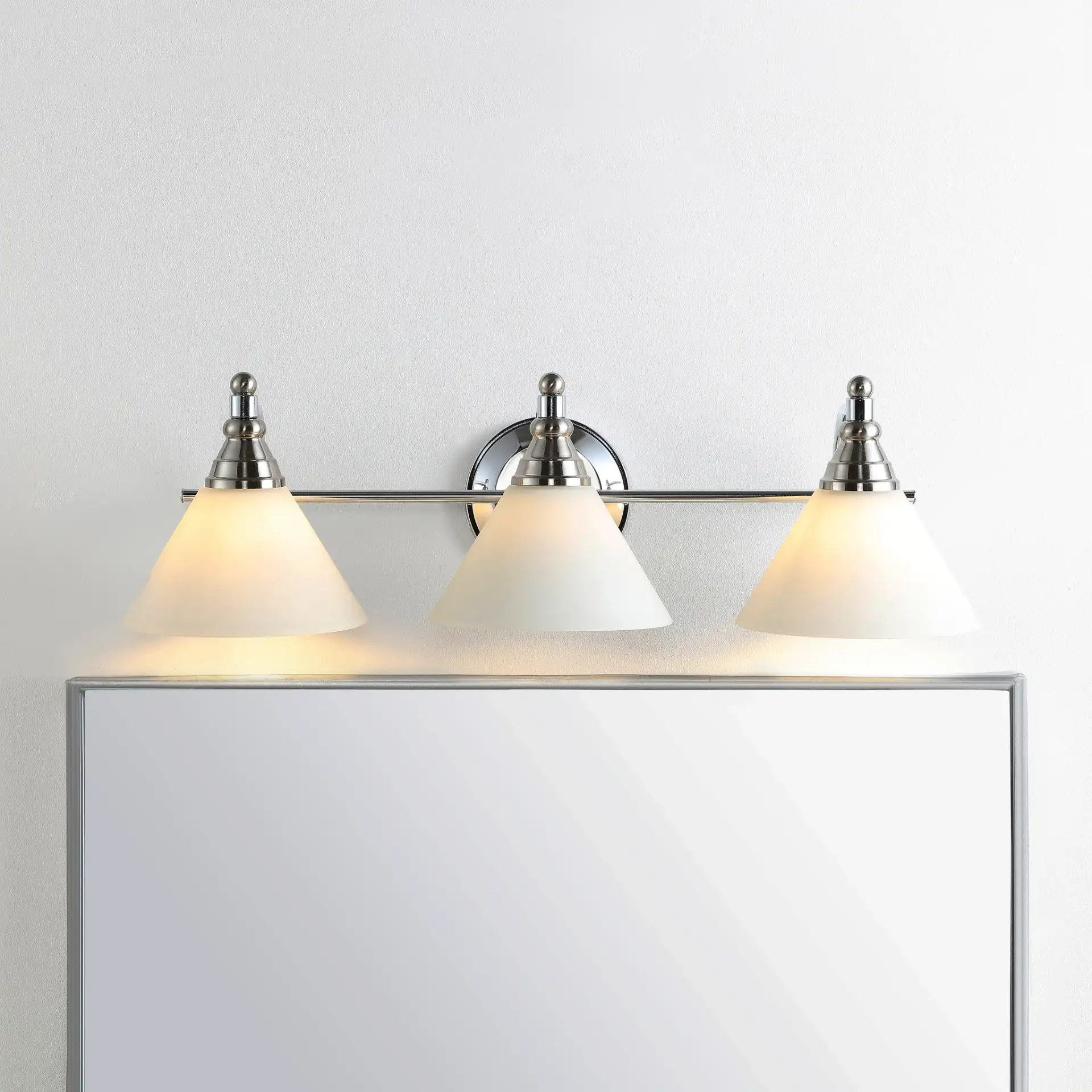 Panya Wall Sconce in Nickel / White in a styled room