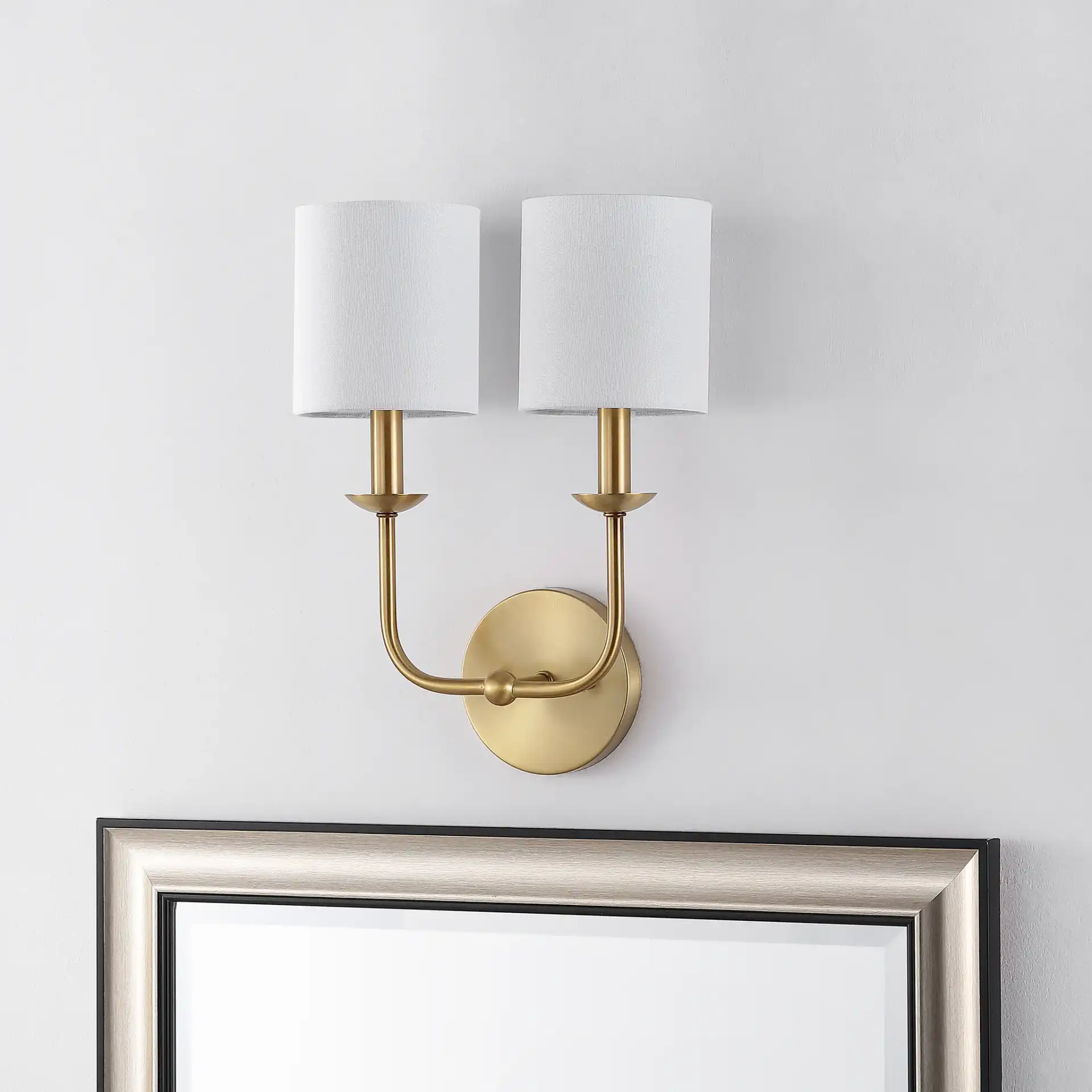 Ferrara Two-Light Wall Sconce in Gold in a styled room