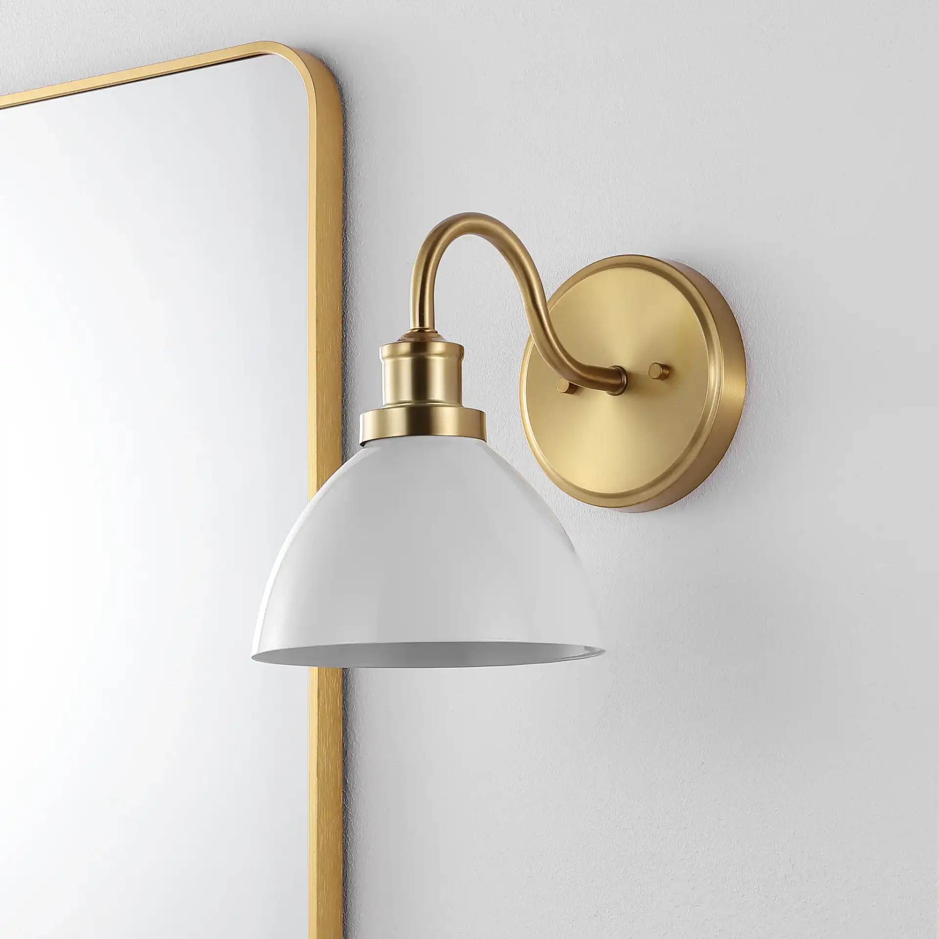 Genetta Wall Sconce in Gold in a styled room