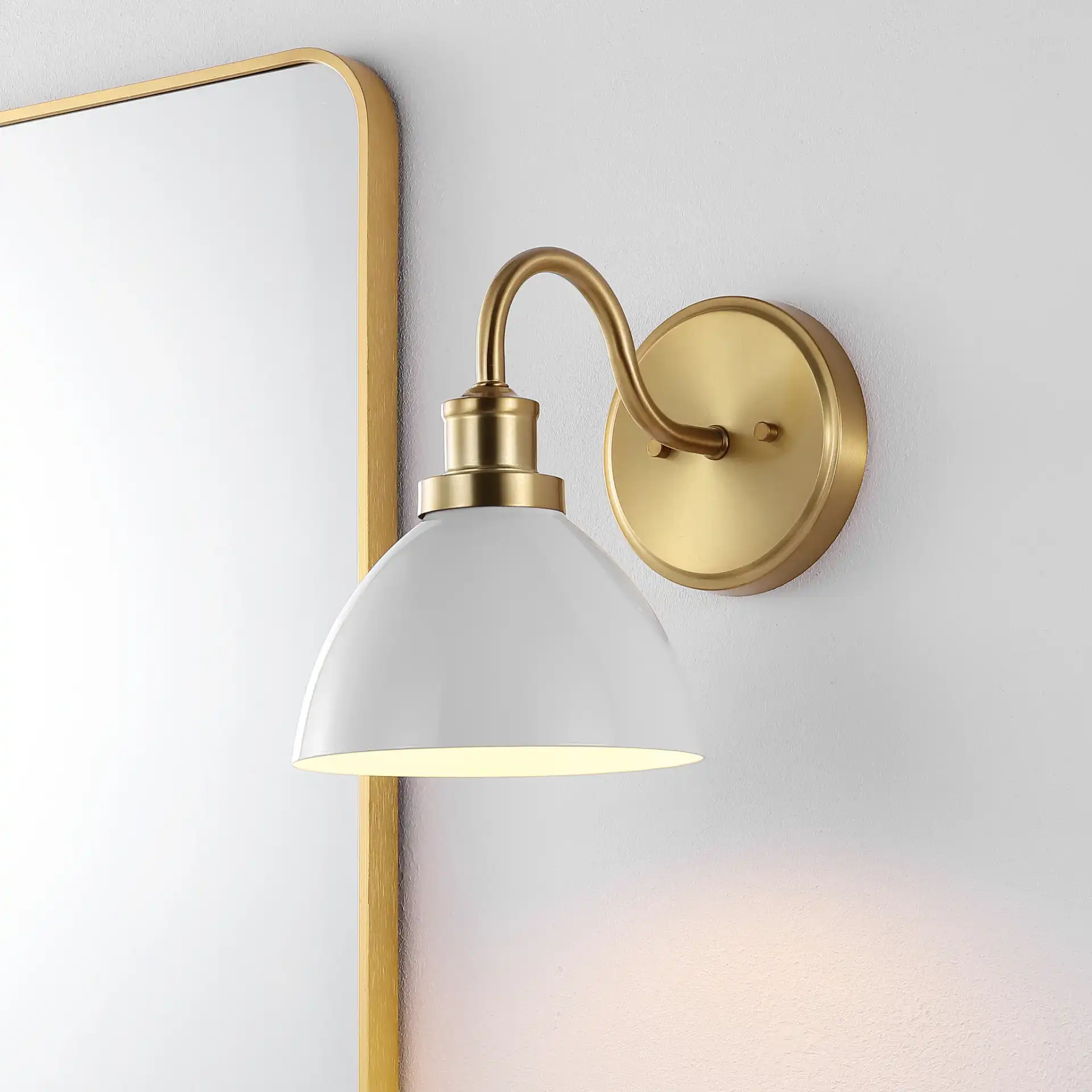 Genetta Wall Sconce in Gold in a styled room