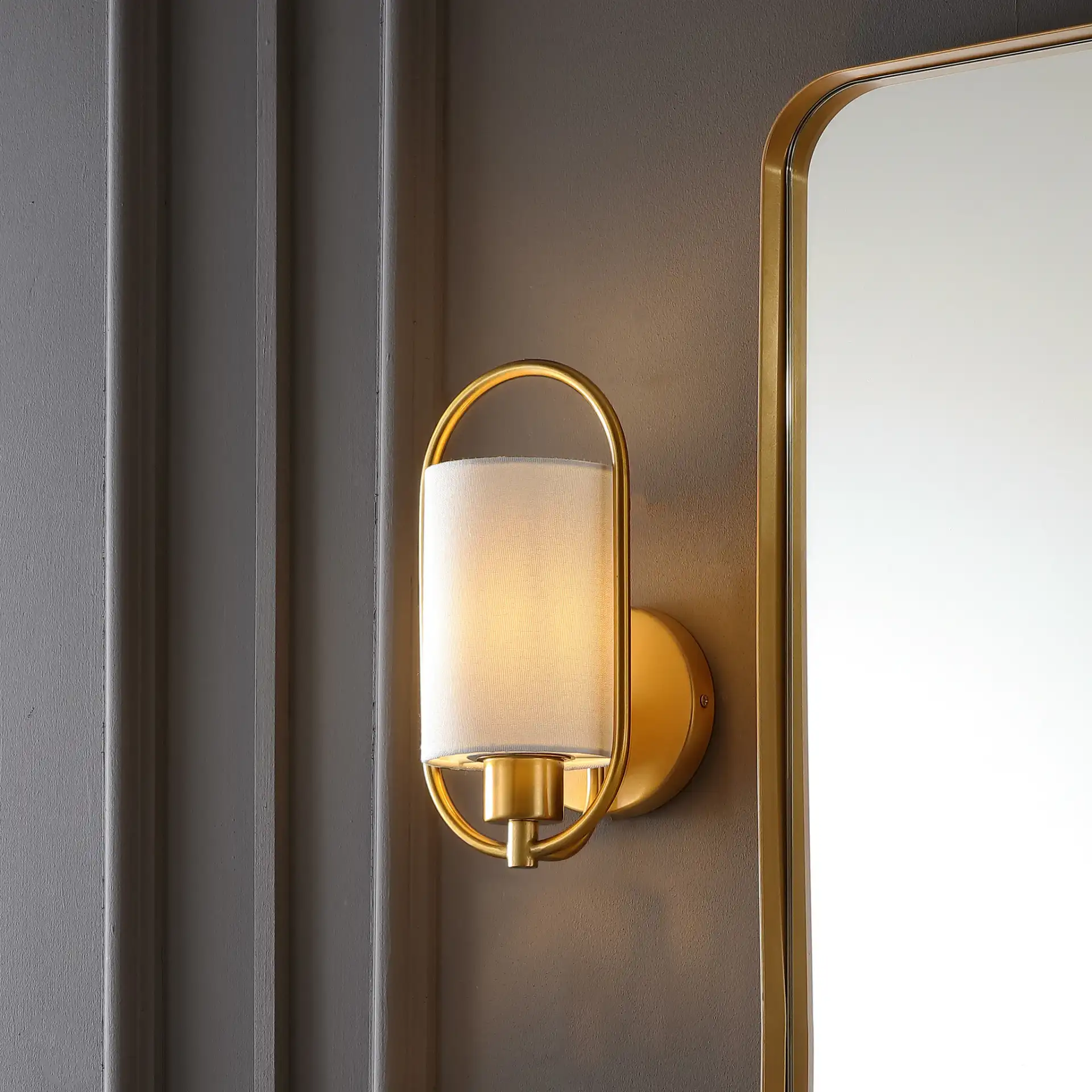 Haldea Wall Sconce in Brass in a styled room