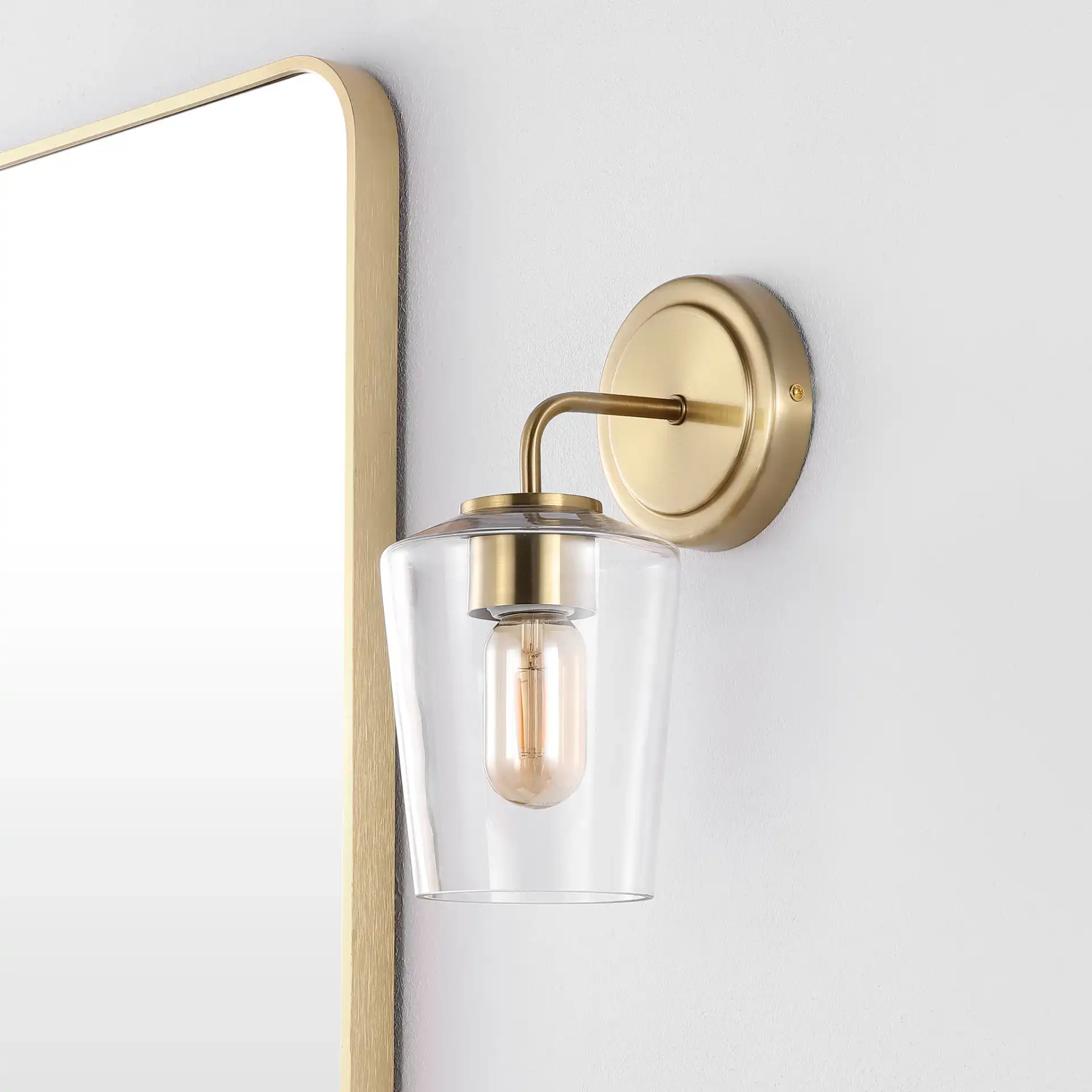 Prospect Wall Sconce in Brass in a styled room