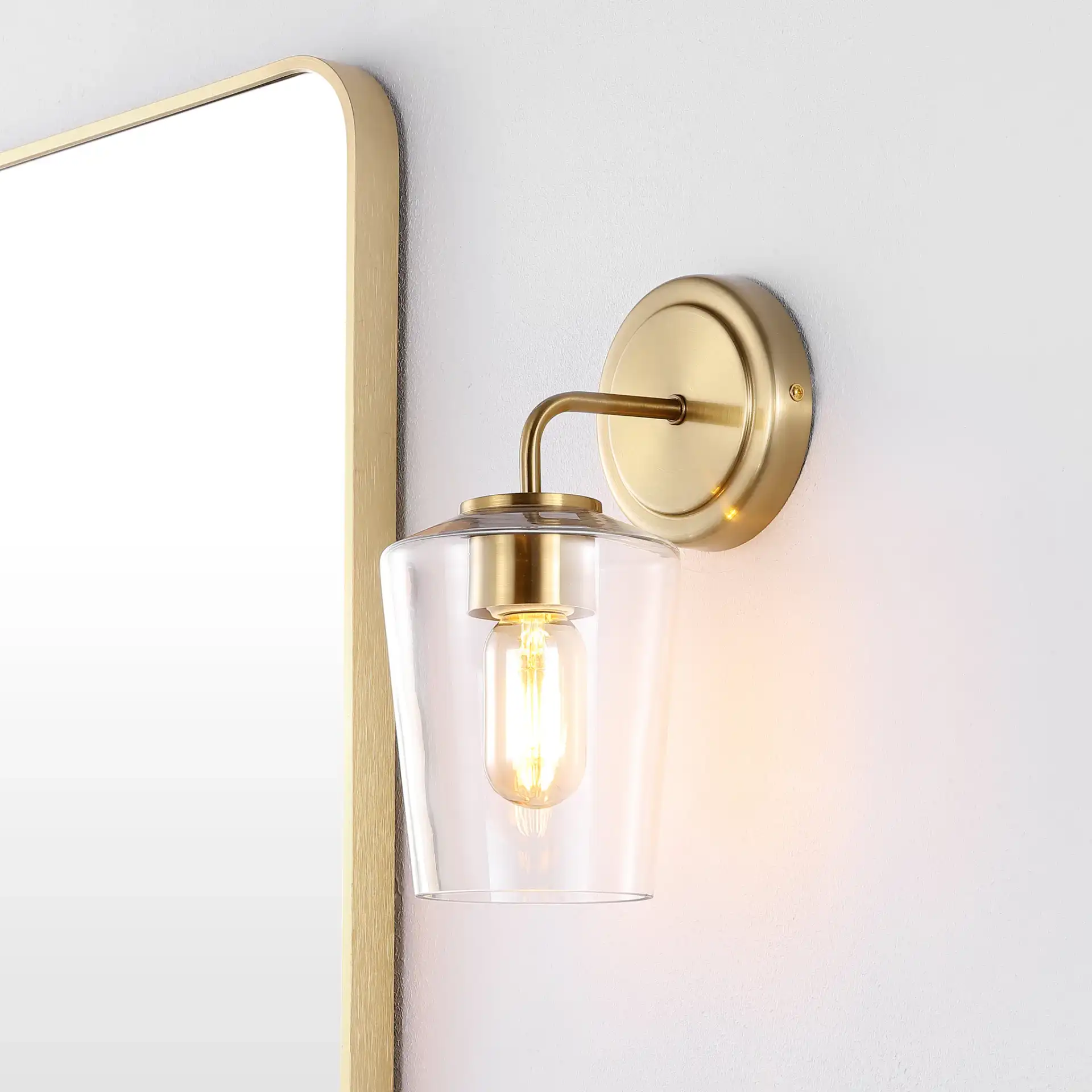 Prospect Wall Sconce in Brass in a styled room