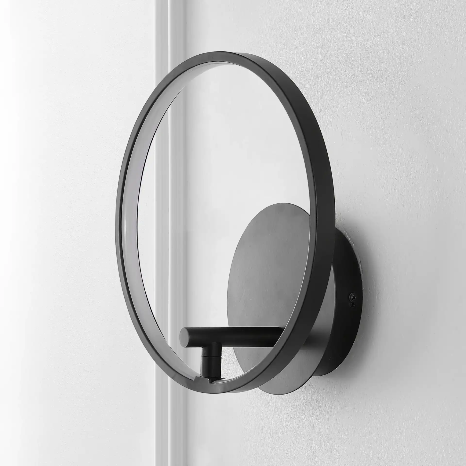 Jolyn Led Wall Sconce in Black in a styled room