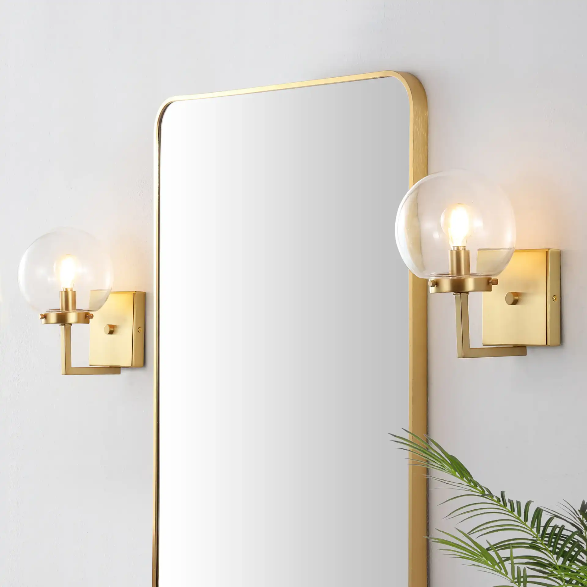 Ganon Wall Sconce (Set Of 2) in Brass / Clear in a styled room