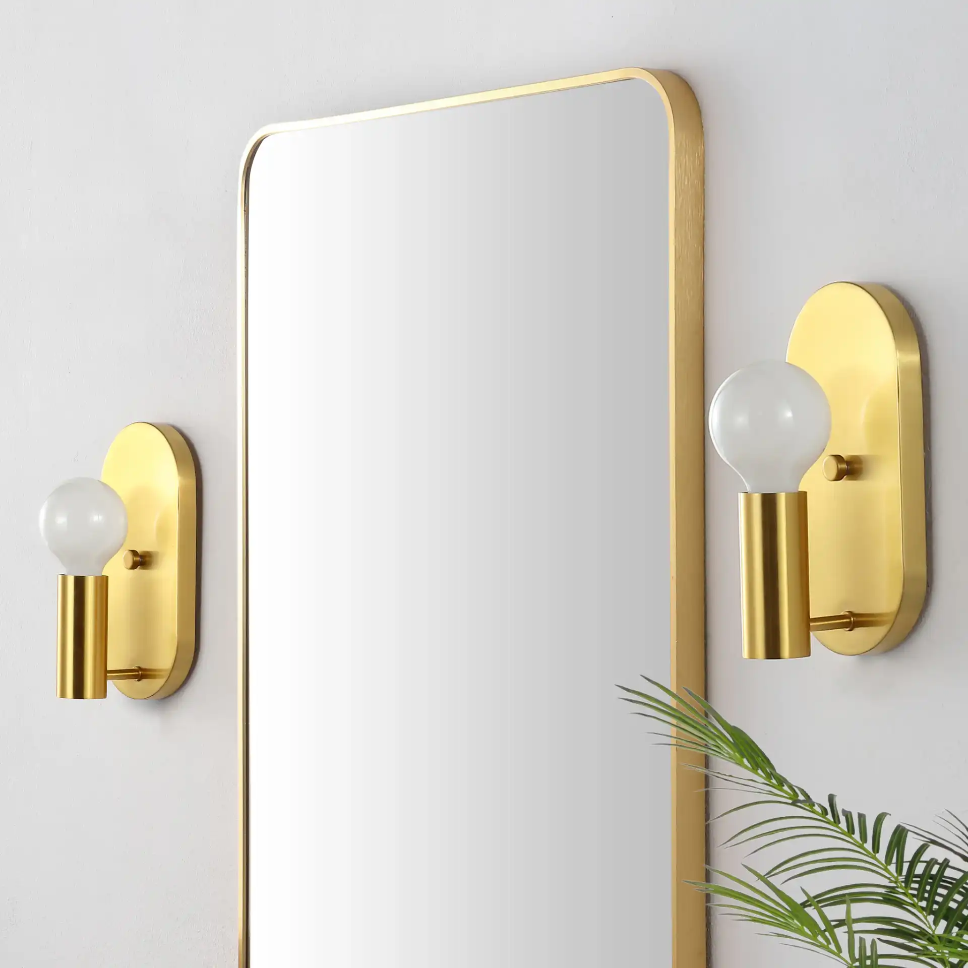 Irima Wall Sconce (Set Of 2) in Brass in a styled room