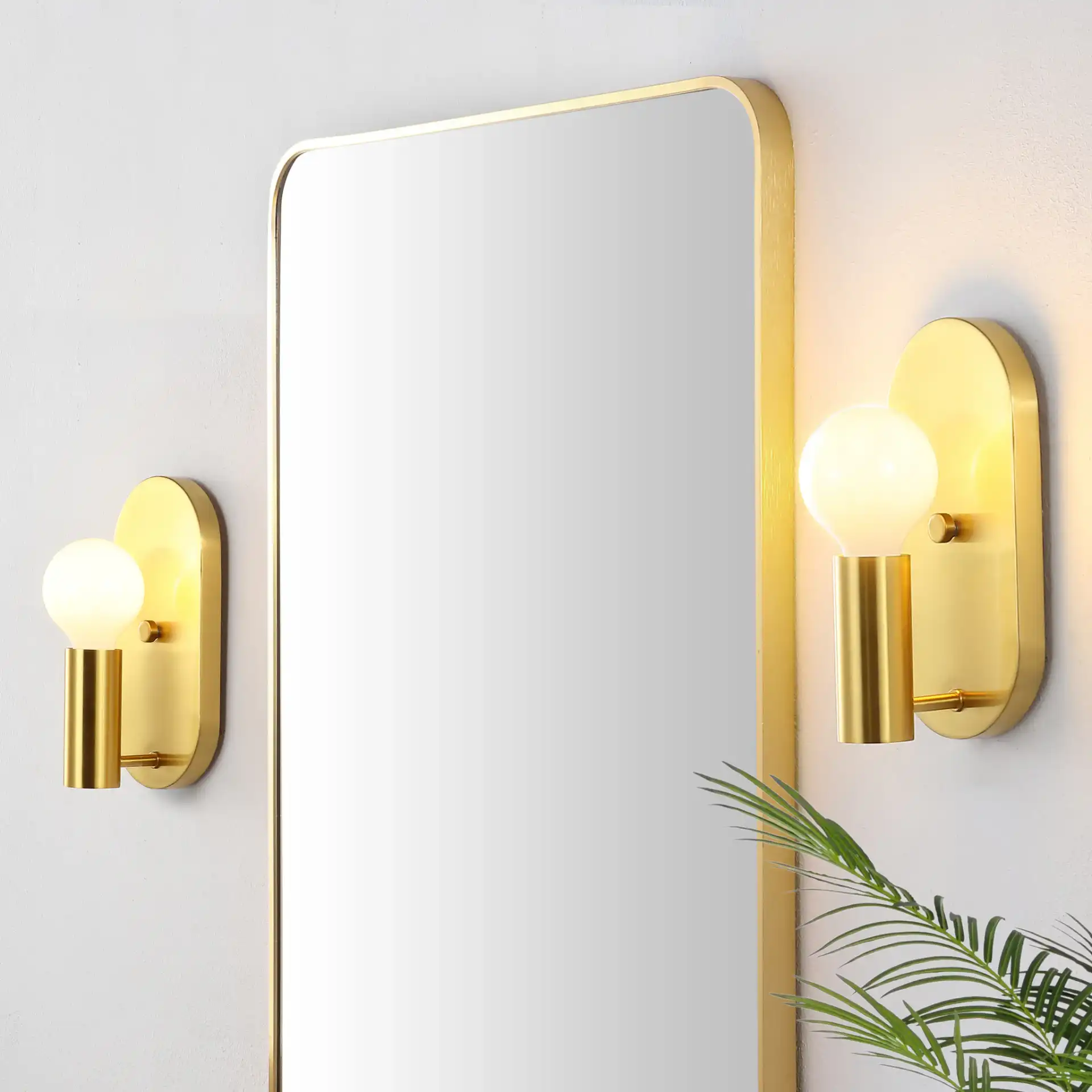 Irima Wall Sconce (Set Of 2) in Brass in a styled room